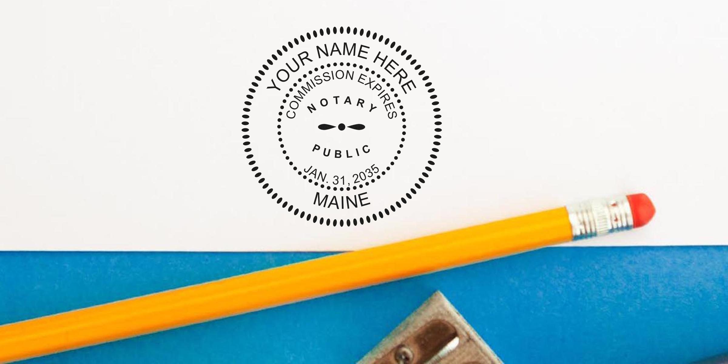 Notary public circular stamp mockup reading "Your Name Here, Commission Expires Jan. 31, 2035, Maine" beside a yellow pencil and metal sharpener on blue and white background
