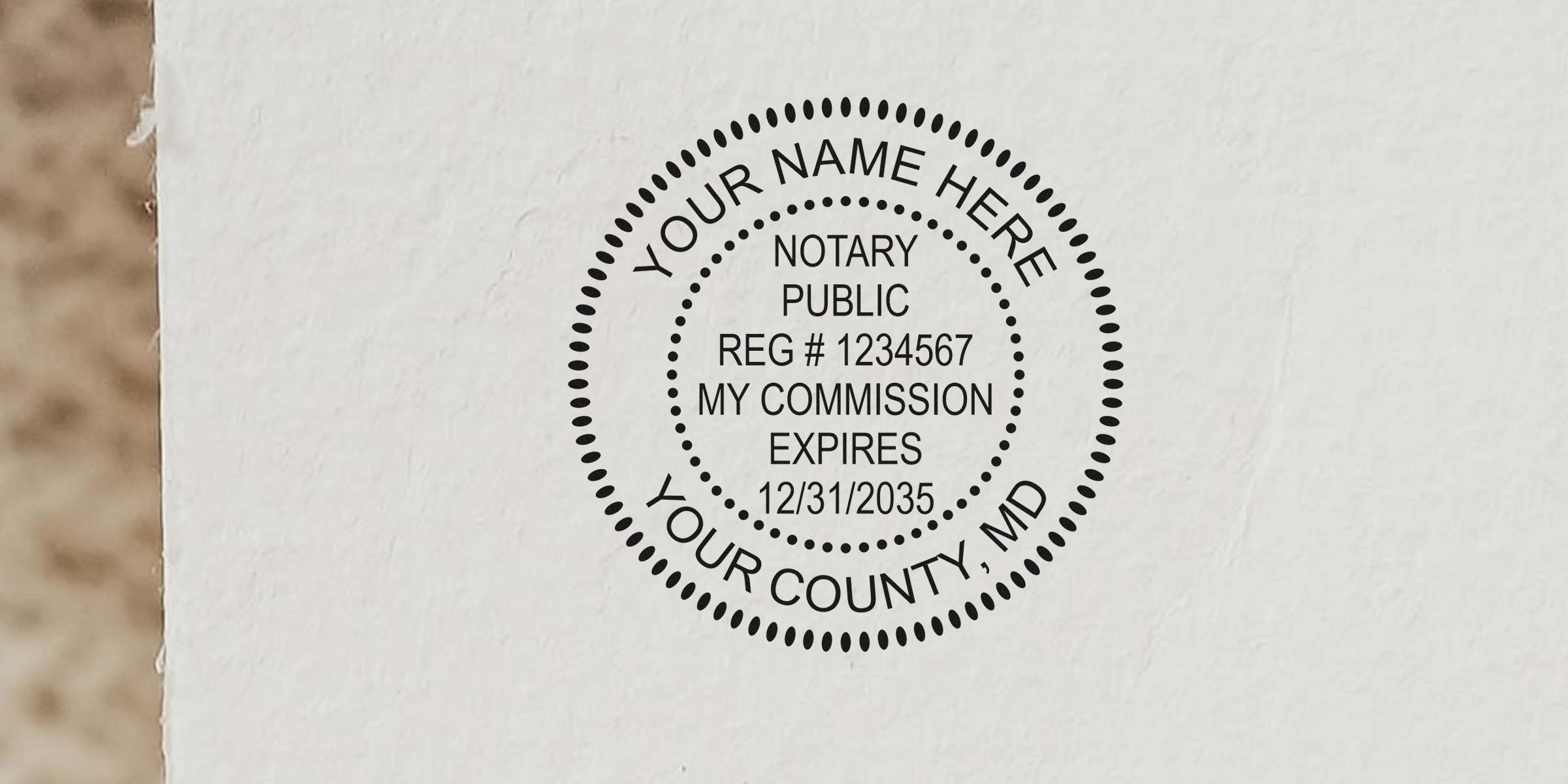 Black circular notary public stamp on textured paper reading "Notary Public REG #1234567 My commission expires 12/31/2035" with placeholder text "Your Name Here" and "Your County, MD."