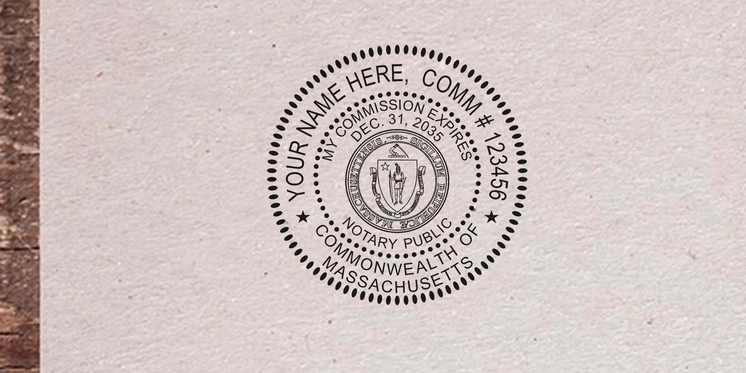 Black circular Massachusetts Notary Public seal stamp on textured paper featuring state coat of arms, placeholder "Your Name Here", commission number, expiration date and "Commonwealth of Massachusetts" text.