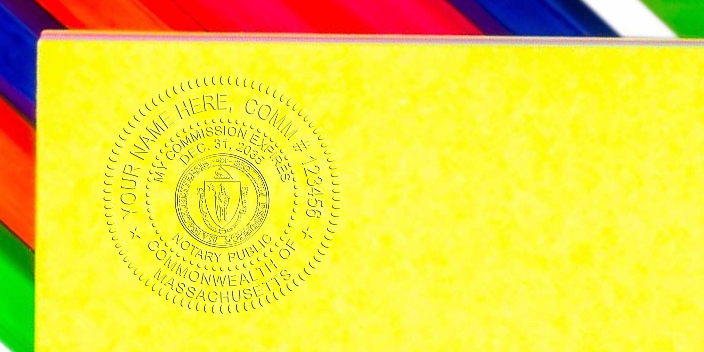 Embossed Massachusetts notary public seal on yellow document paper with vibrant multicolor diagonal edge, close-up detail