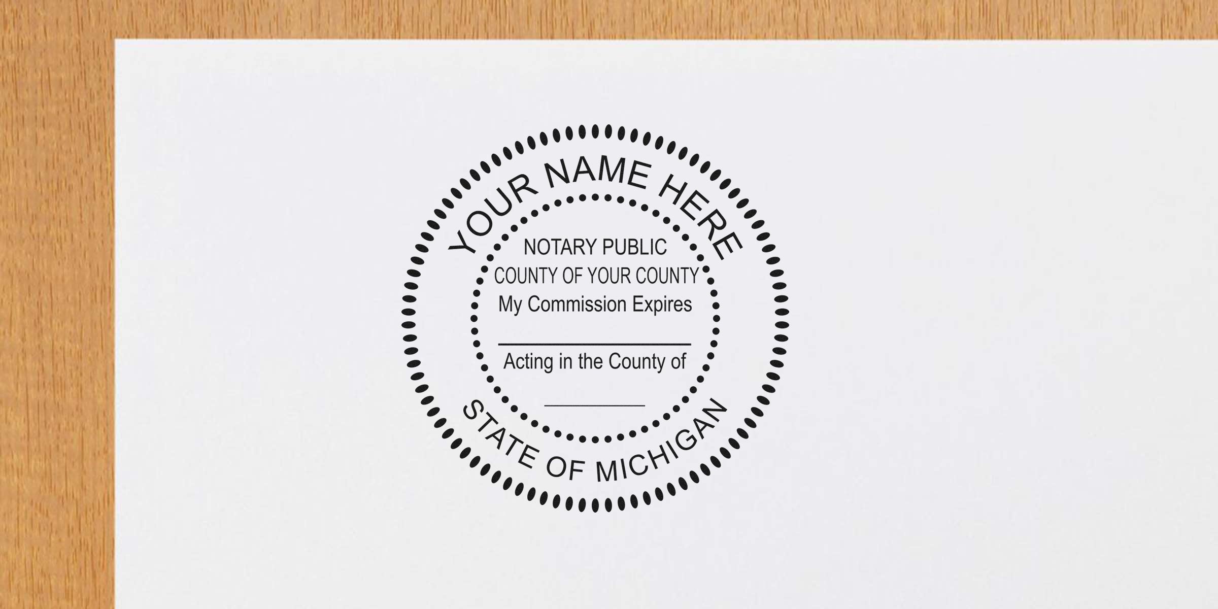 Round notary public seal mockup reading "Your Name Here" and "State of Michigan" printed on white paper on a wooden desk — notary stamp template