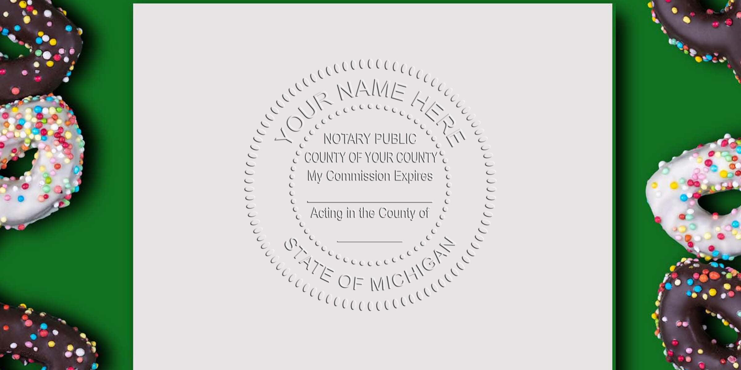Embossed notary seal on white paper reading "Your Name Here, State of Michigan" centered on green background with chocolate and vanilla sprinkled donuts framing both sides, flat lay legal document and pastry composition.