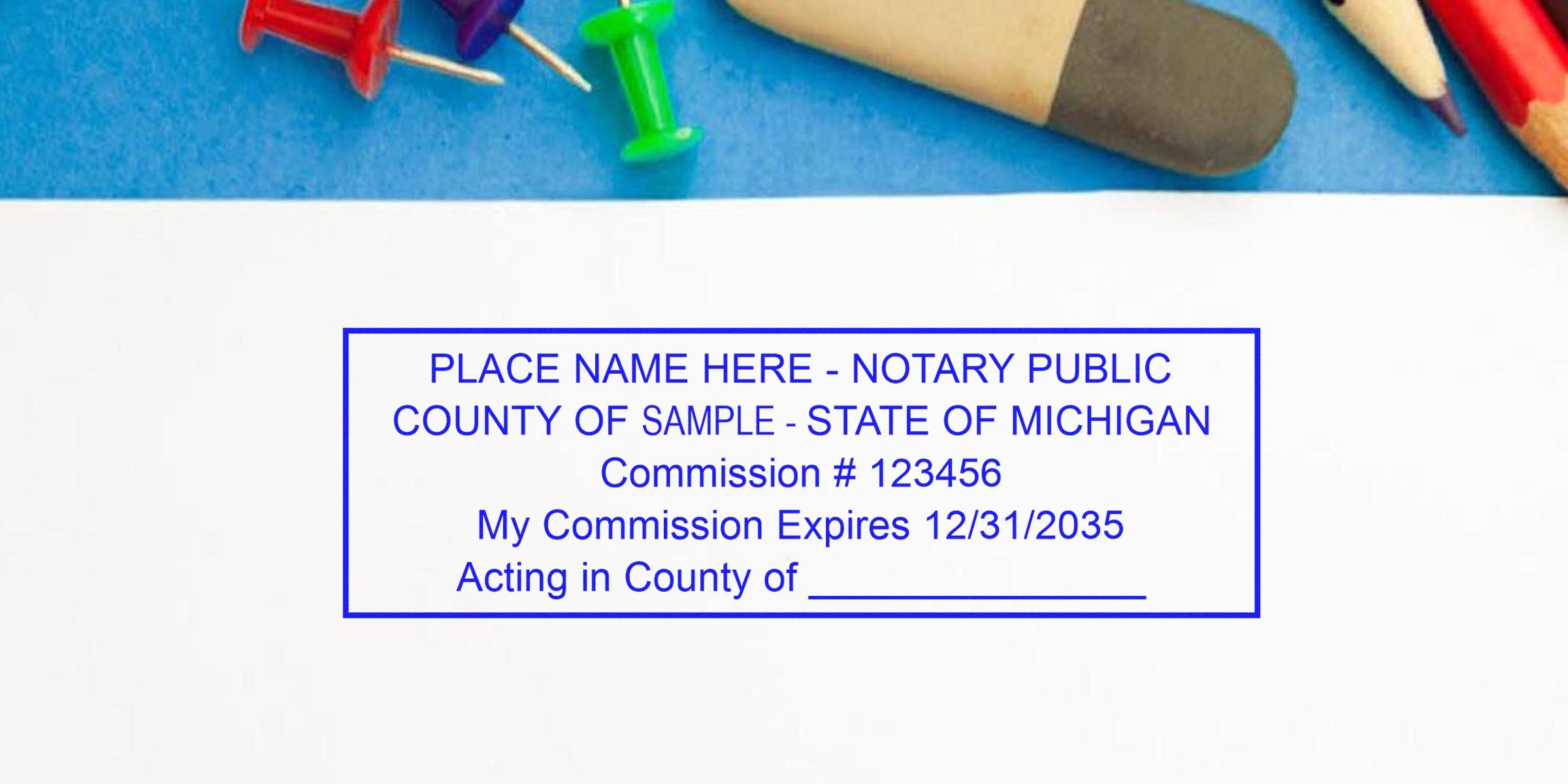 Sample Michigan notary stamp imprint on white paper showing placeholder name, county, Commission #123456 and expiration 12/31/2035, framed by pencils, eraser and colorful push pins