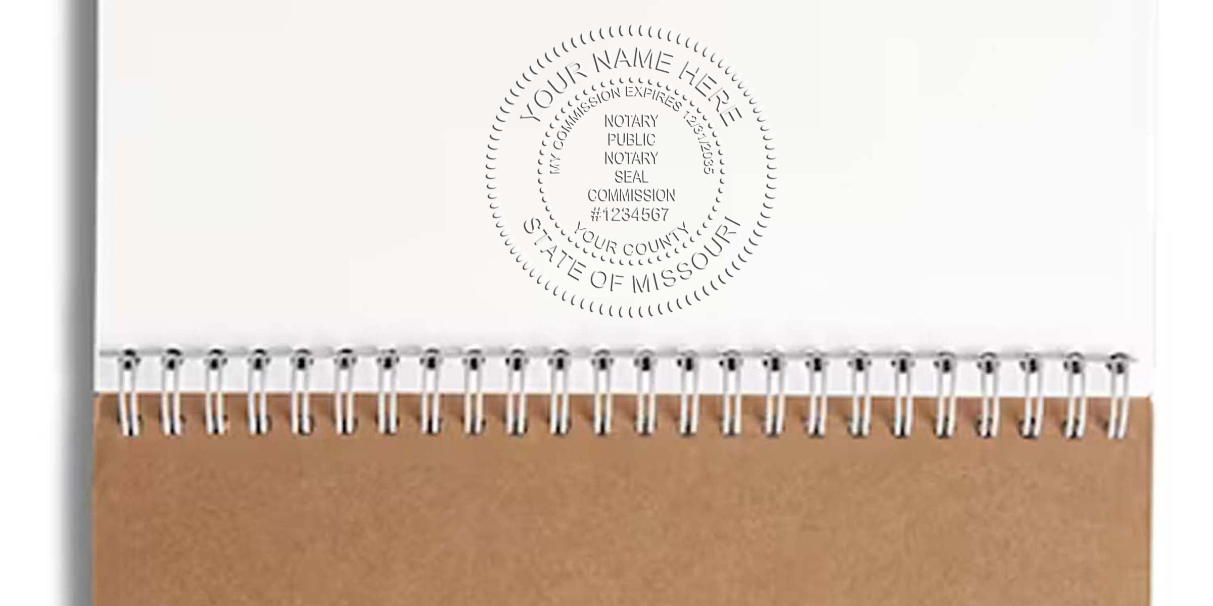 Spiral-bound notebook with kraft brown cover, blank white pages and embossed notary public mock seal reading "State of Missouri"