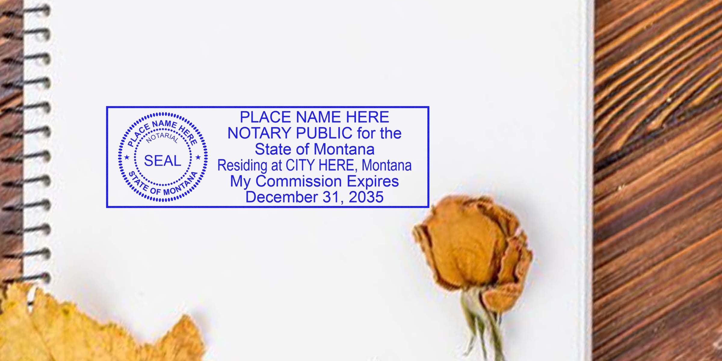 Blue Montana notary public stamp mockup on white spiral notebook page, circular seal and rectangular text block reading "NOTARY PUBLIC State of Montana… My Commission Expires December 31, 2035," with dried flowers and wood grain background