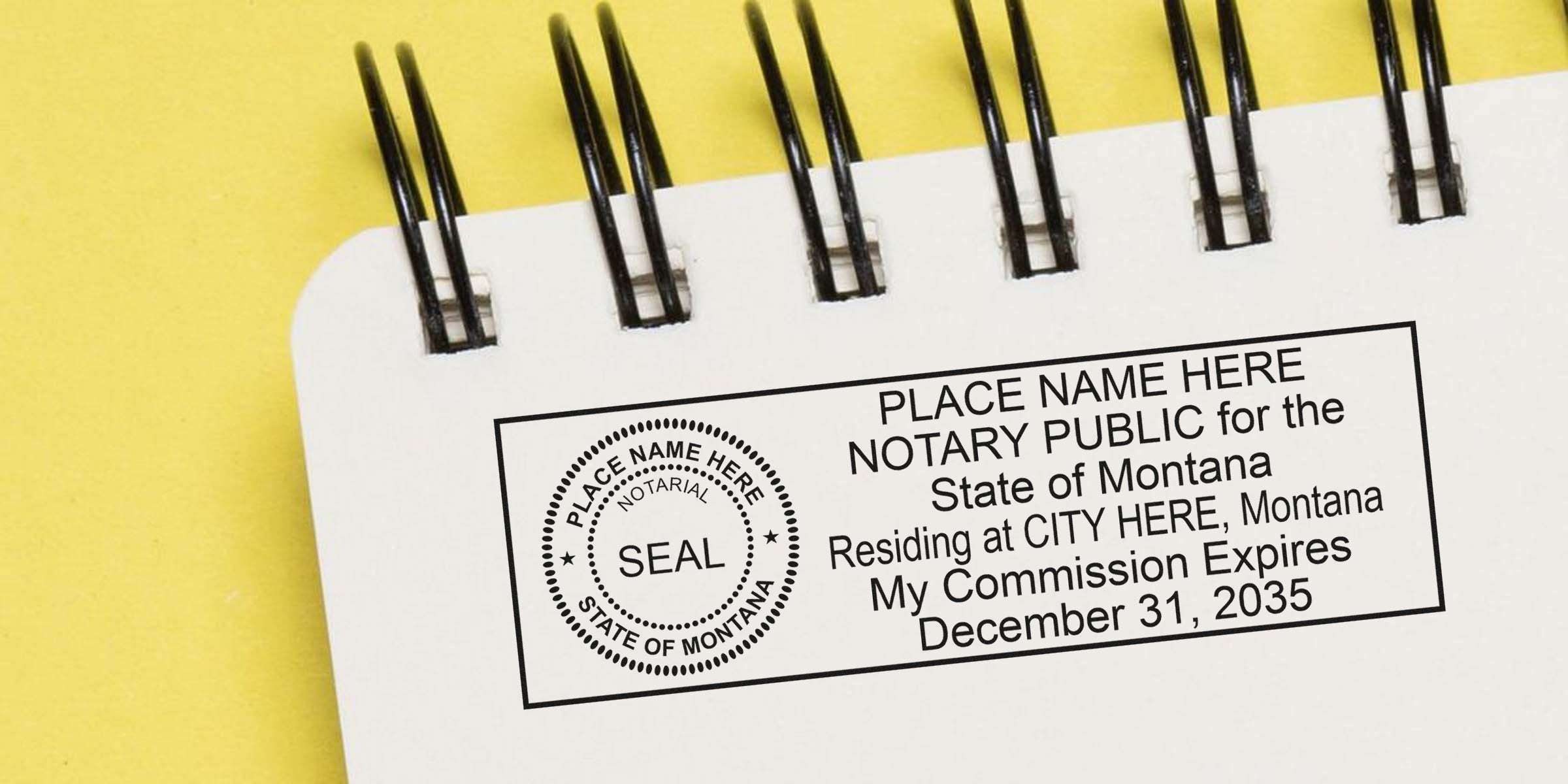 Close-up of a spiral-bound white notebook page displaying a rectangular Montana notary public stamp sample with circular seal, placeholder name and city text, and commission expiration date on a yellow background.