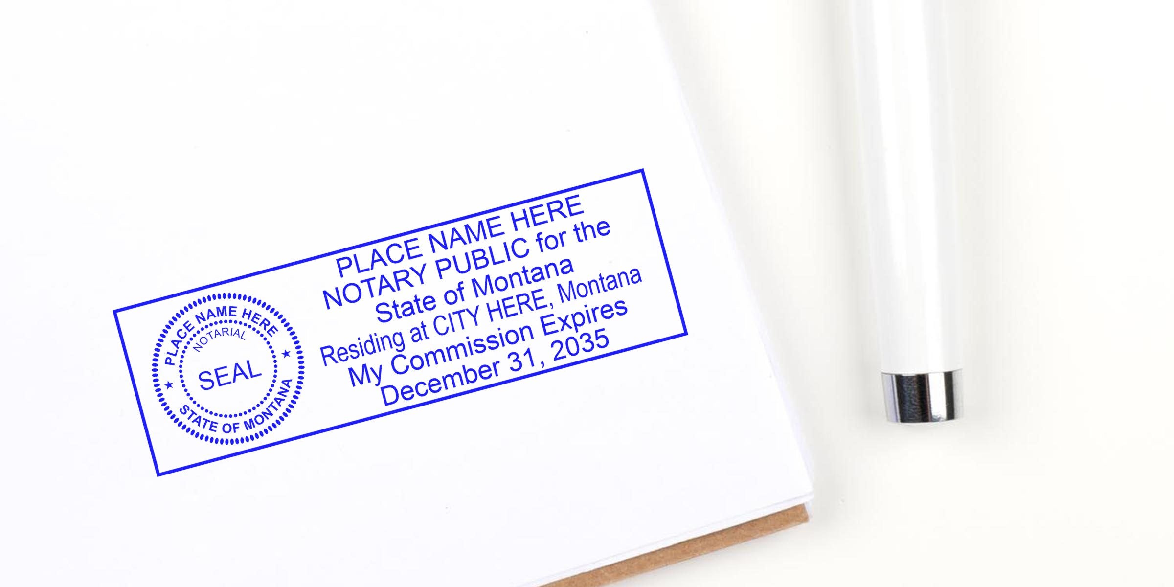 Blue notary public stamp impression on white paper reading “Place Name Here, Notary Public for the State of Montana” with circular seal and sample expiration date, beside a white pen on a clean desk background