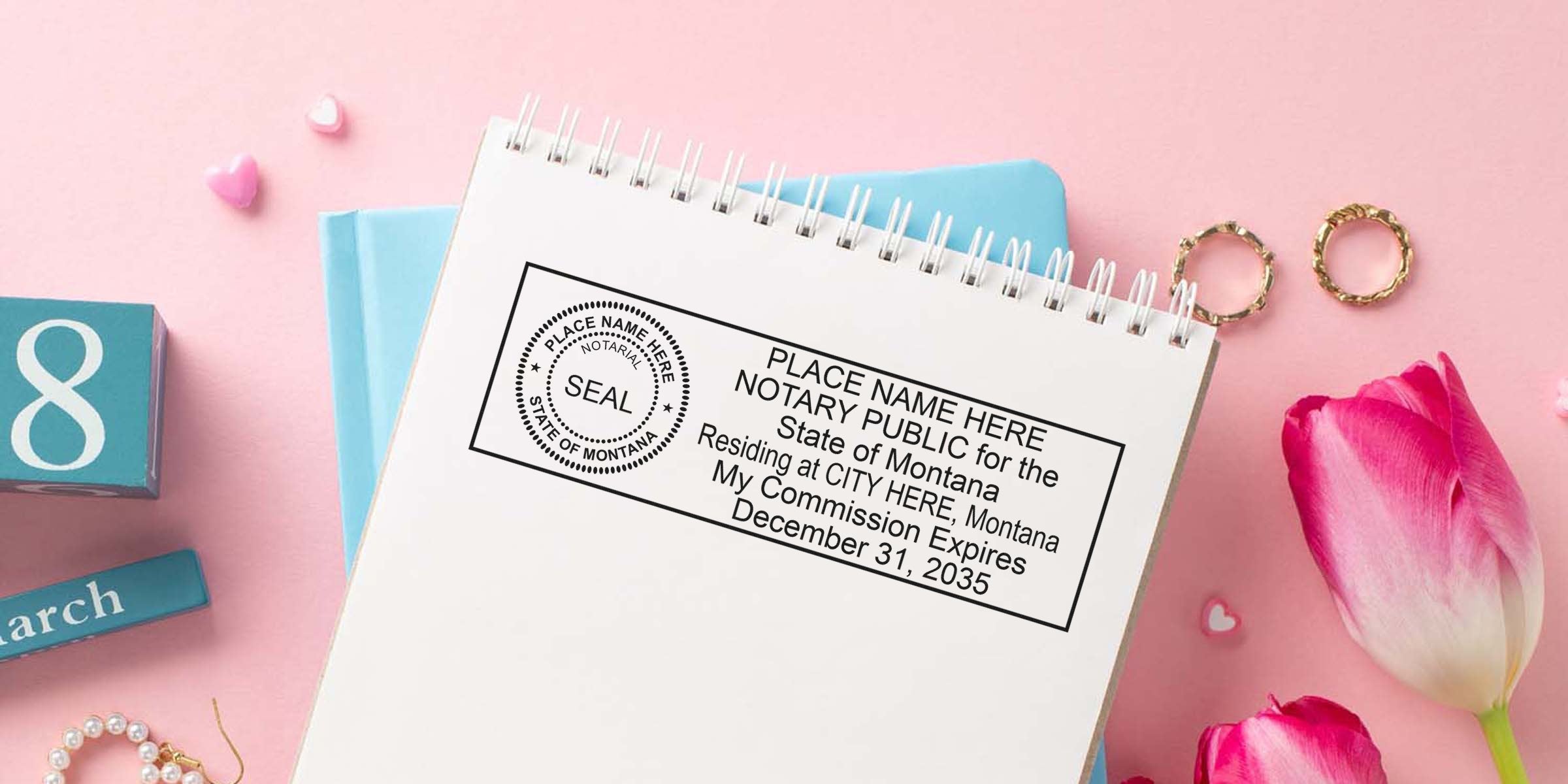Notary public stamp mockup on spiral notebook page against pink background with pink tulips, gold rings, pearl bracelet and blue March calendar block — business stationery concept for notary, seal, and commission expiration details.