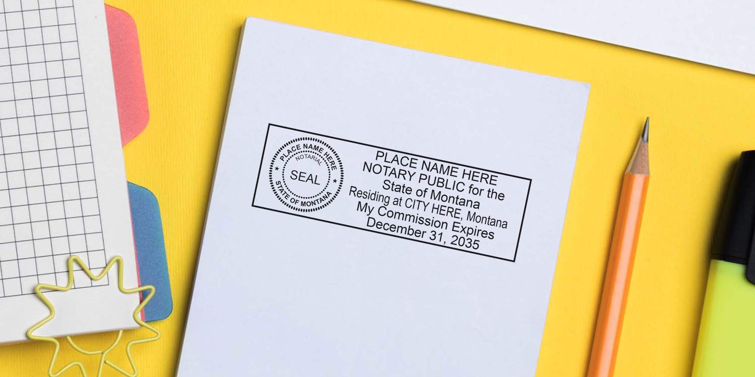 Flat lay of a notary public stamp imprint on a white document surrounded by a pencil, highlighter and grid paper on a yellow background