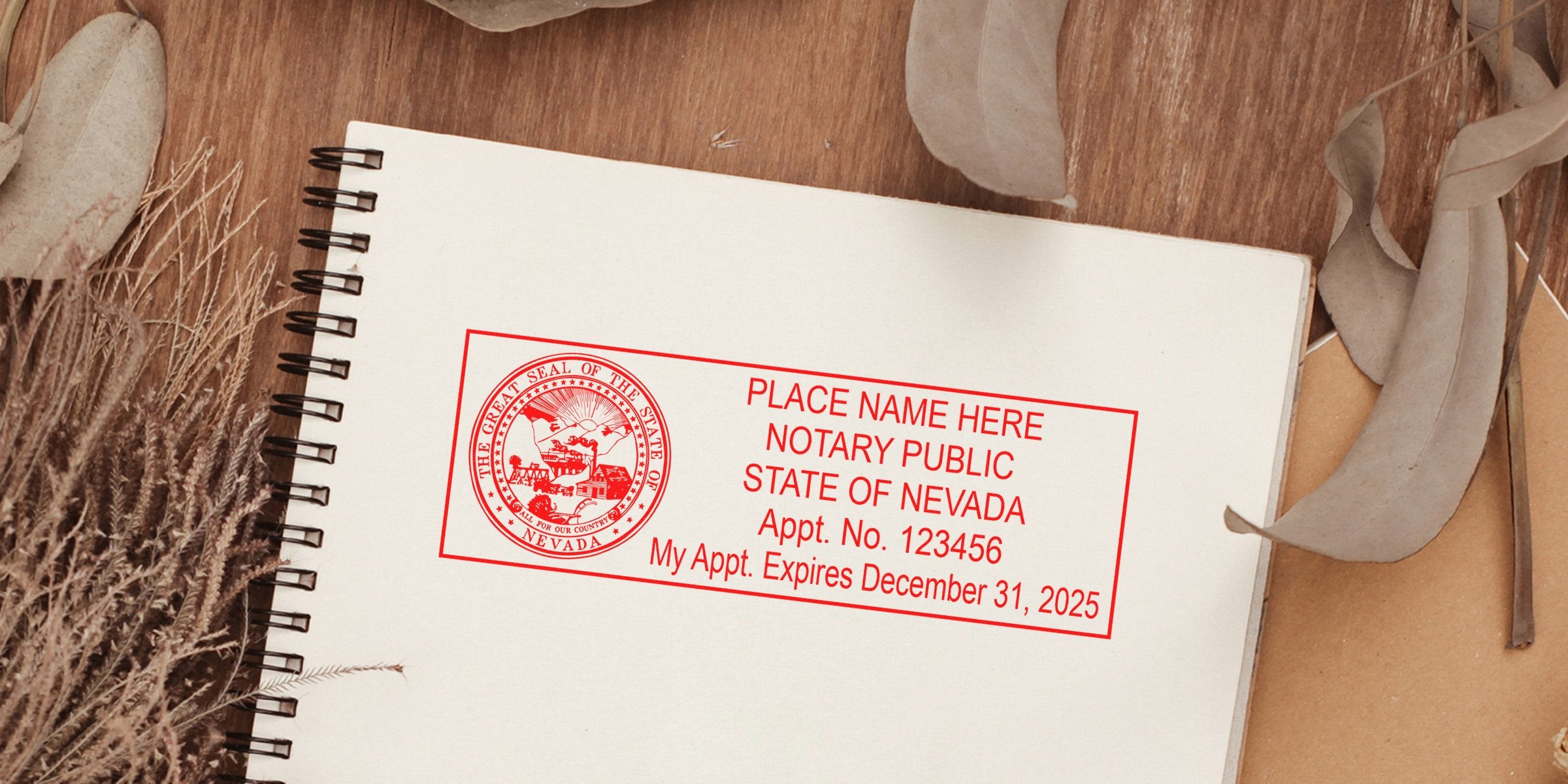 Red Nevada notary public stamp on white spiral notebook page showing state seal, appointment no. 123456 and expiration Dec 31, 2025, rustic wooden background