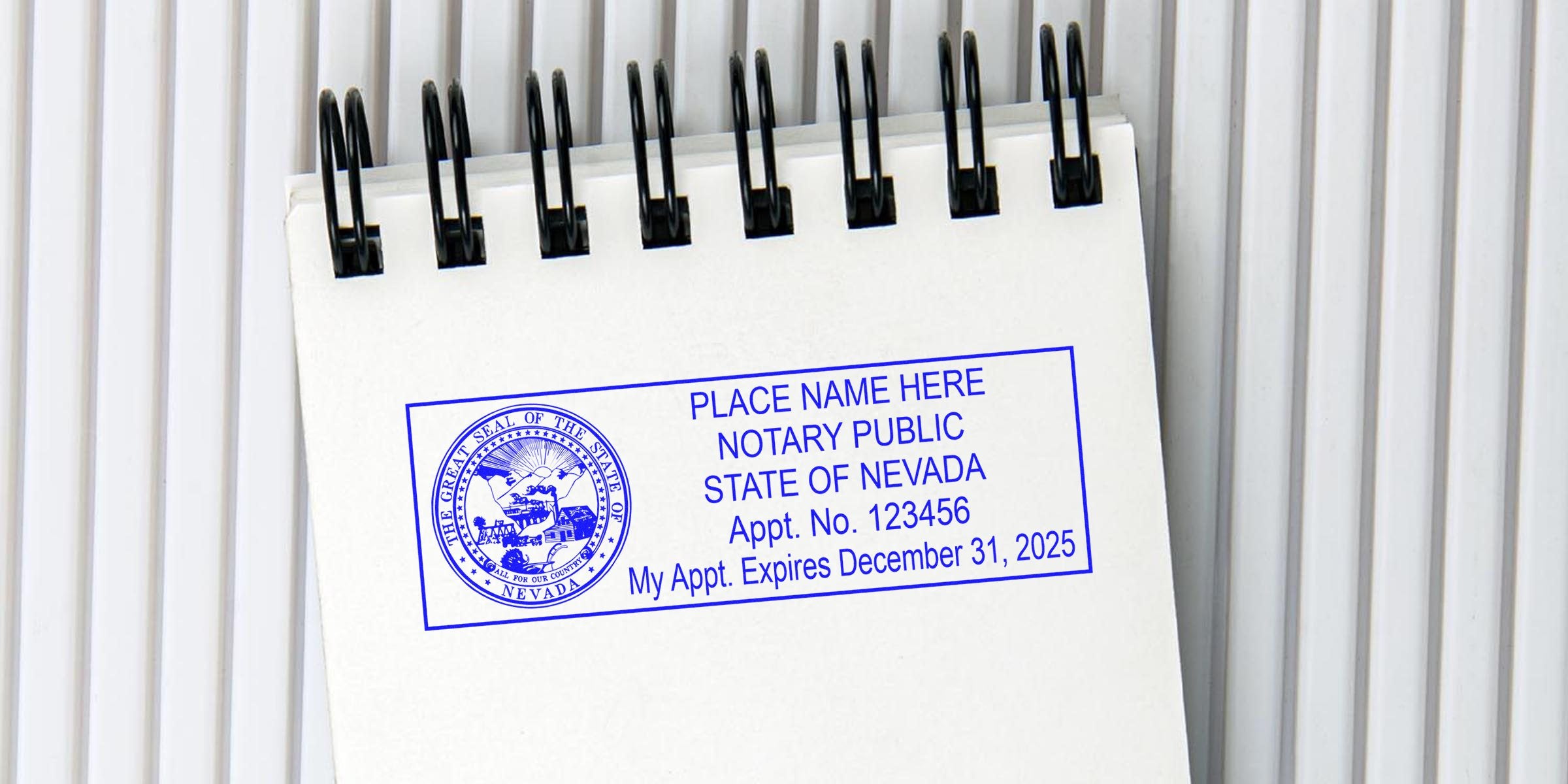 Blue ink Nevada notary public stamp on spiral notepad showing placeholder name, Appt. No. 123456 and expiration December 31, 2025