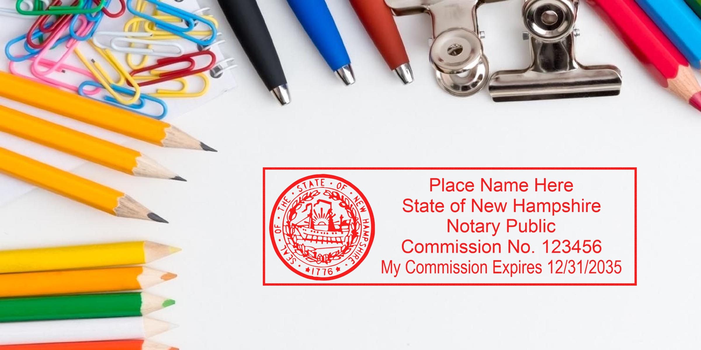Red New Hampshire notary public rubber stamp template with seal and sample commission info on white background, surrounded by pencils, colored pencils, paperclips, ballpoint pens and binder clips — office supplies and notary stamp mockup