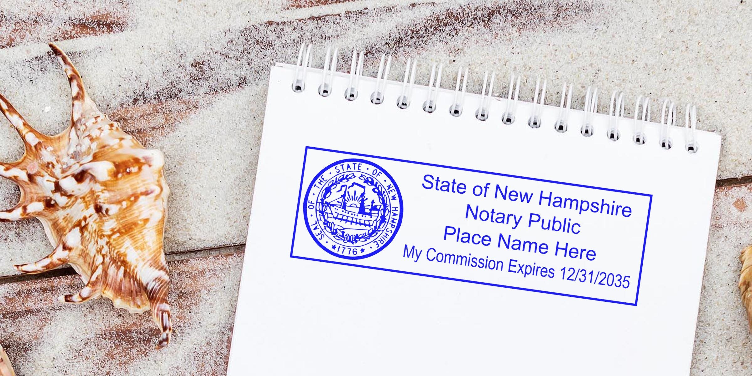 State of New Hampshire notary public blue stamp on a spiral notebook page, beach seashells and sandy wooden background