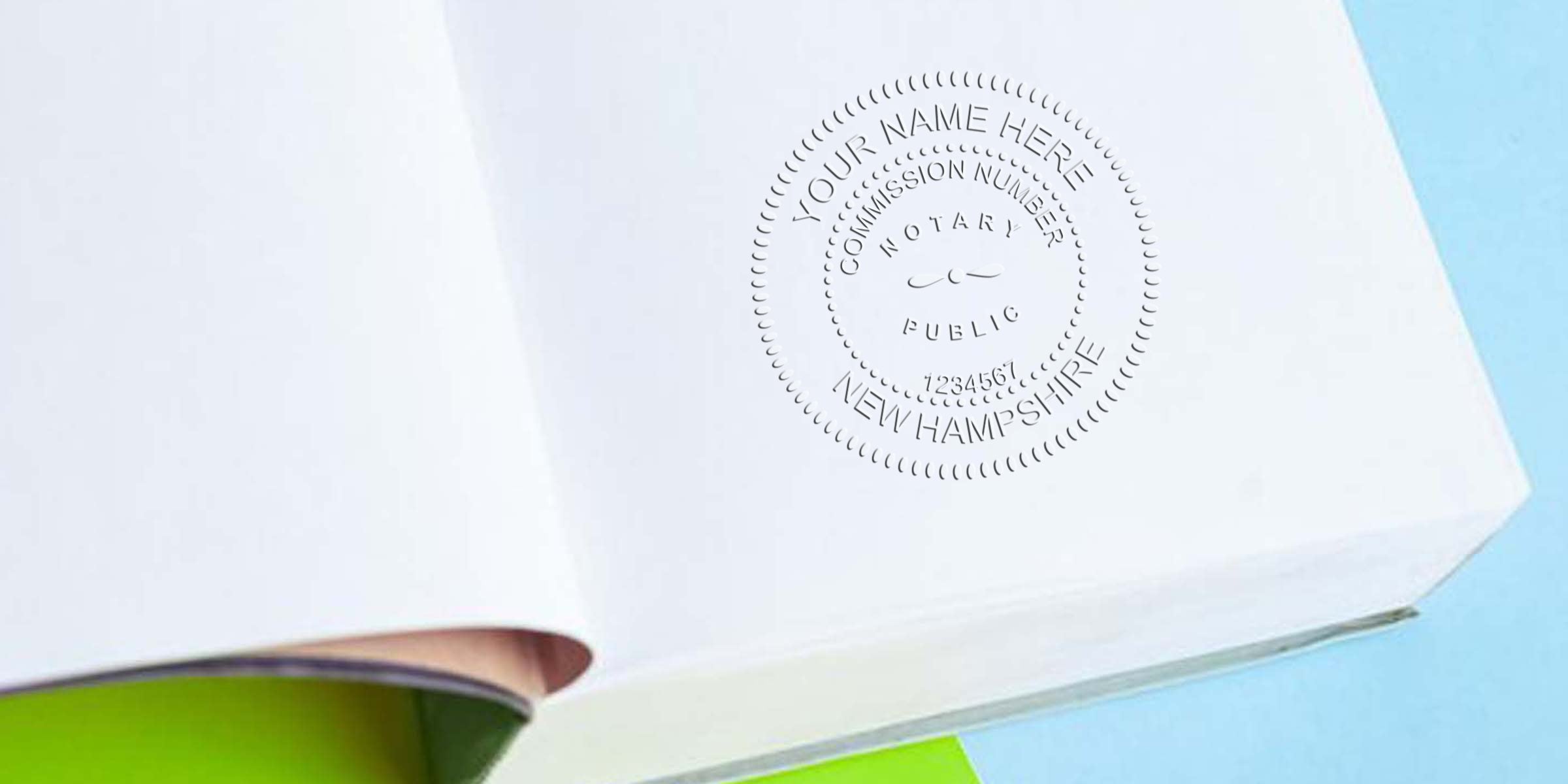 Notary blind emboss stamp on white paper/book reading "Notary Public, New Hampshire" with circular seal detail on a white page against blue and green background, close-up texture of embossed stationery.