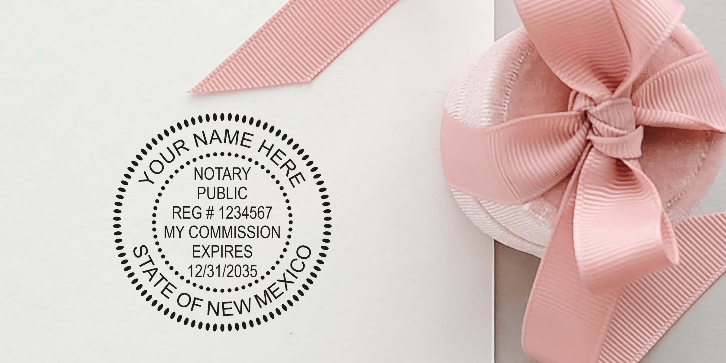 Notary public seal stamp mockup reading "State of New Mexico" beside a pink ribbon bow on white paper, ideal for notary or stationery branding
