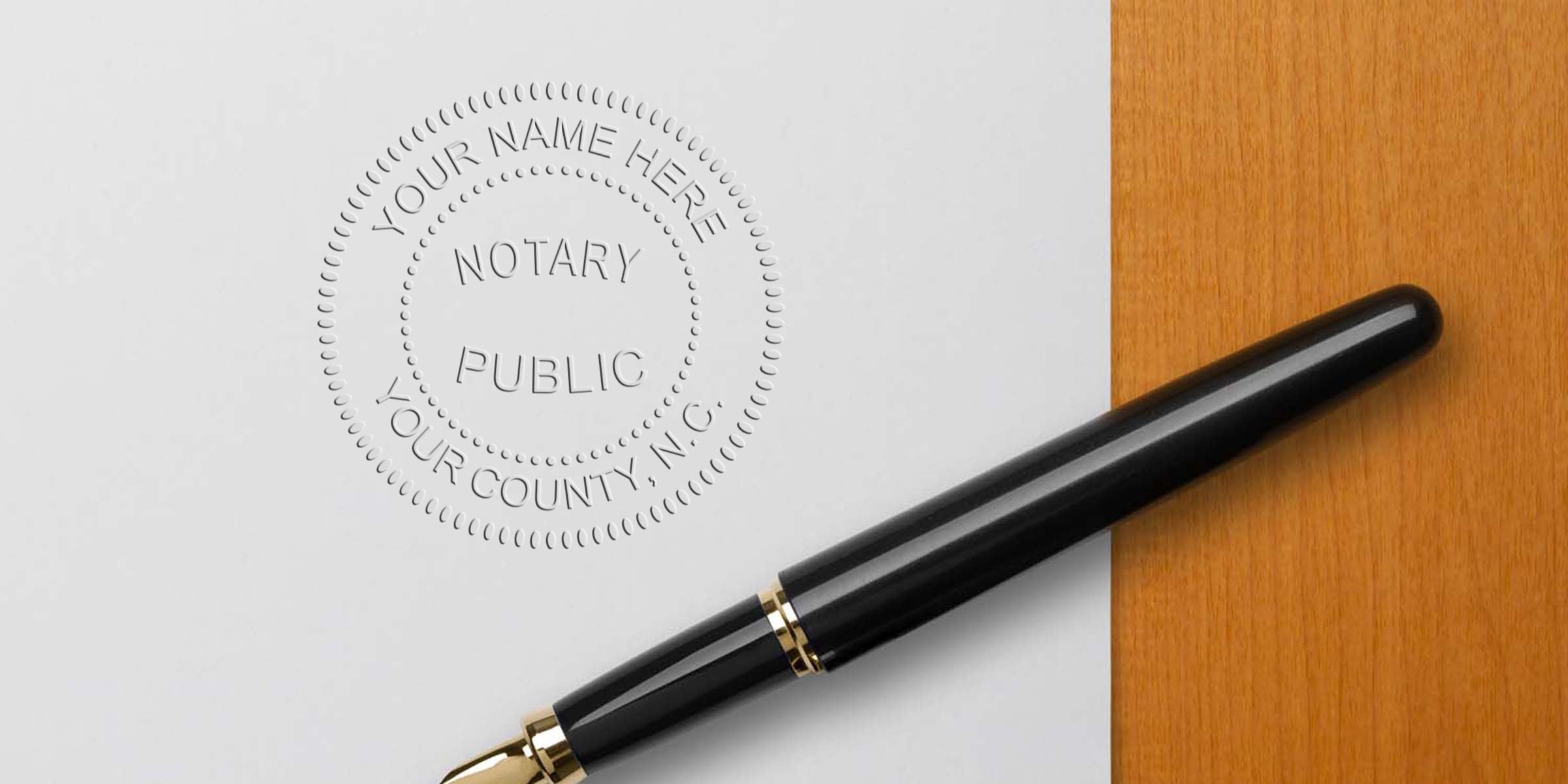 Black fountain pen beside embossed notary public seal on white paper over wooden desk, customizable "Your Name Here, Your County" impression for legal document authentication and notary services