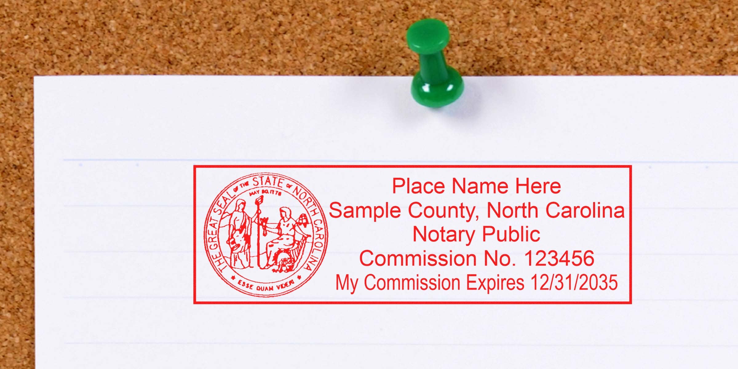 Red rectangular North Carolina notary public stamp sample on lined white paper pinned with a green pushpin to a cork bulletin board