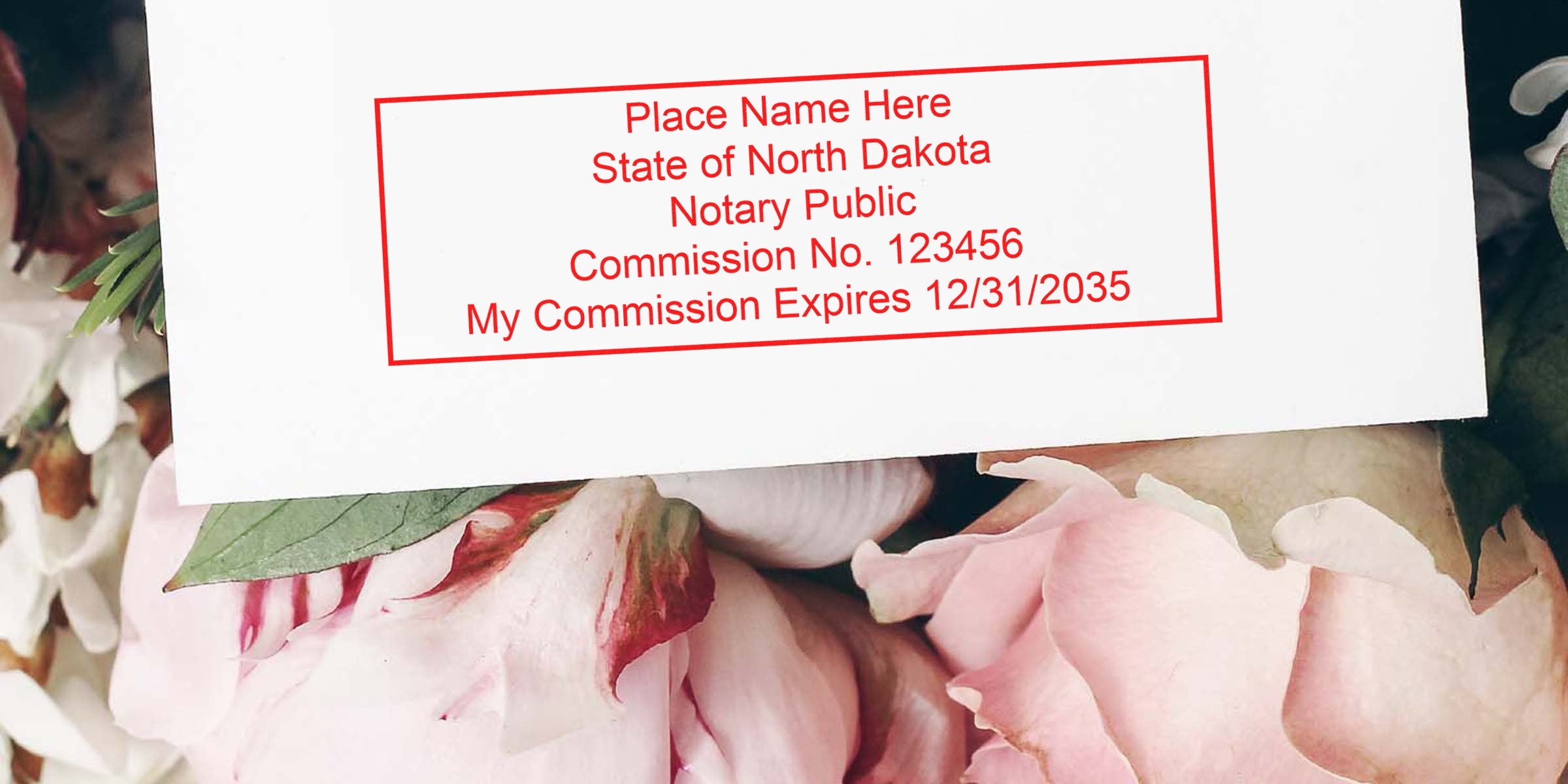 Red notary stamp on white card reading "State of North Dakota Notary Public Commission No. 123456 My Commission Expires 12/31/2035" over pink peony flowers