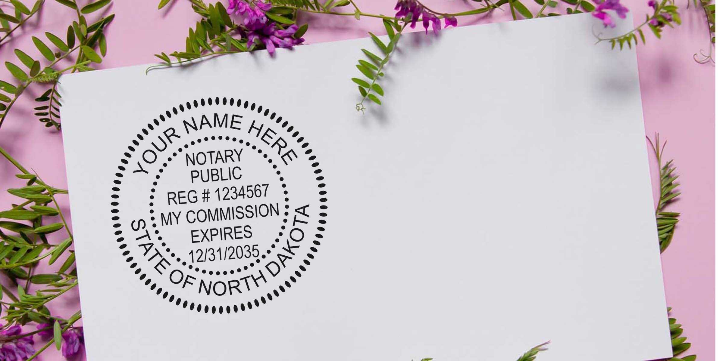 Notary public stamp mockup on white paper with floral background reading "Your Name Here, State of North Dakota," registration number and commission expiration — office seal design for notaries