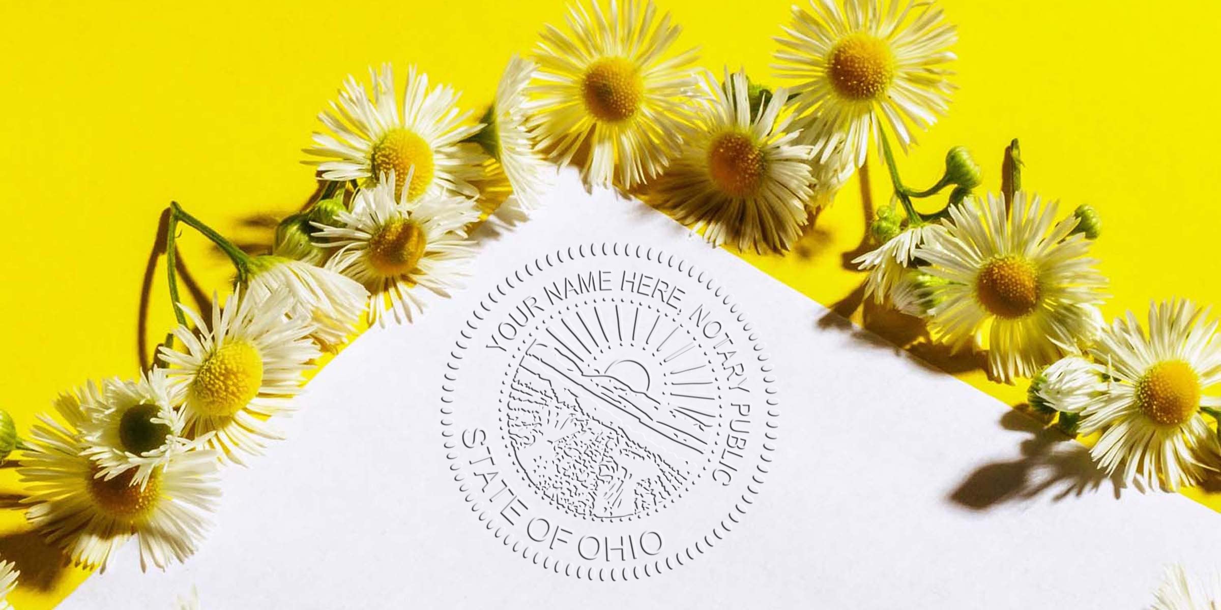 Bright yellow daisies on a vibrant yellow background beside white paper embossed with a circular "State of Ohio" notary public seal