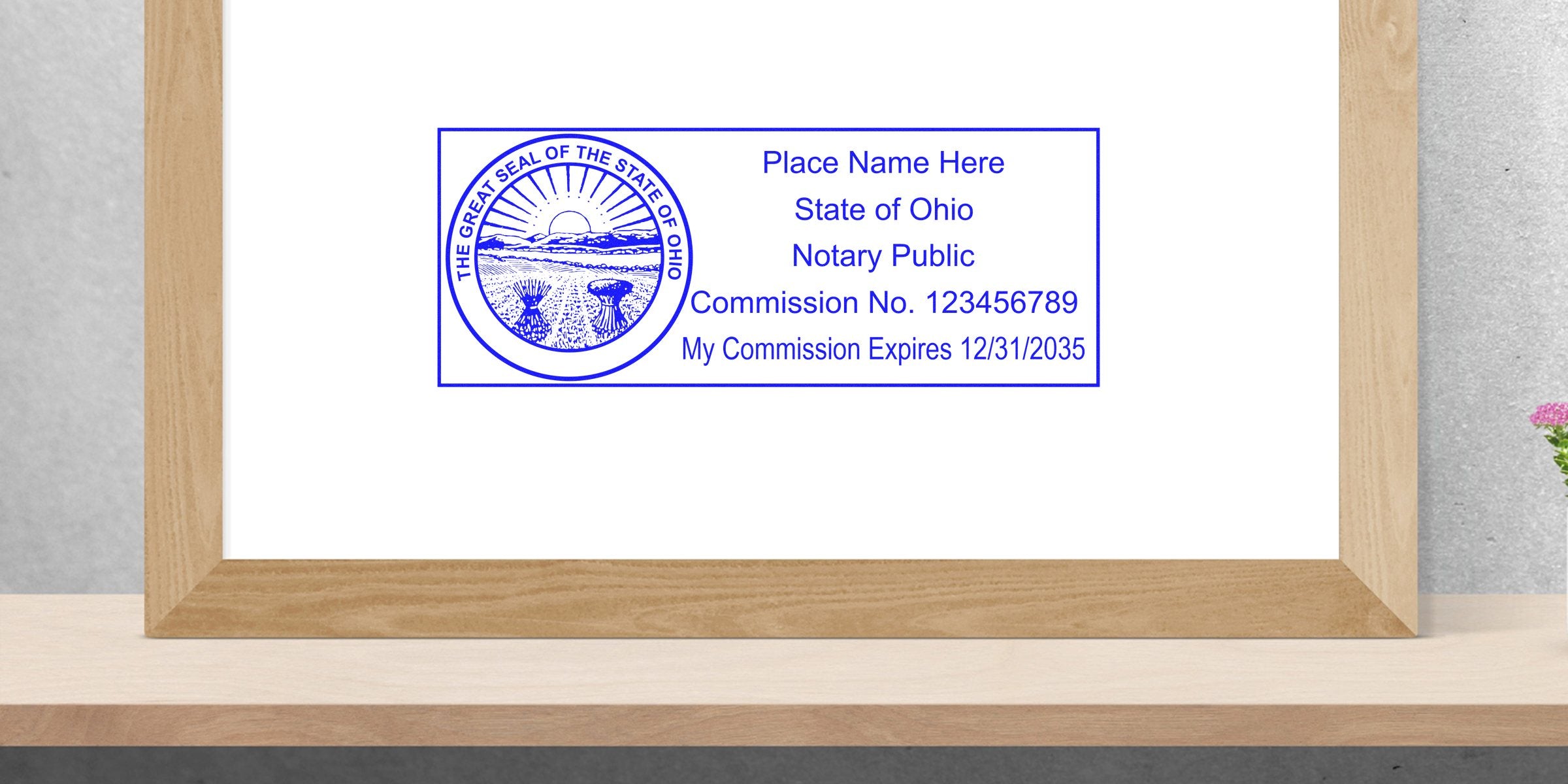 Blue rectangular Ohio notary public stamp template with the Great Seal of the State of Ohio, placeholder name, commission number and expiration date.