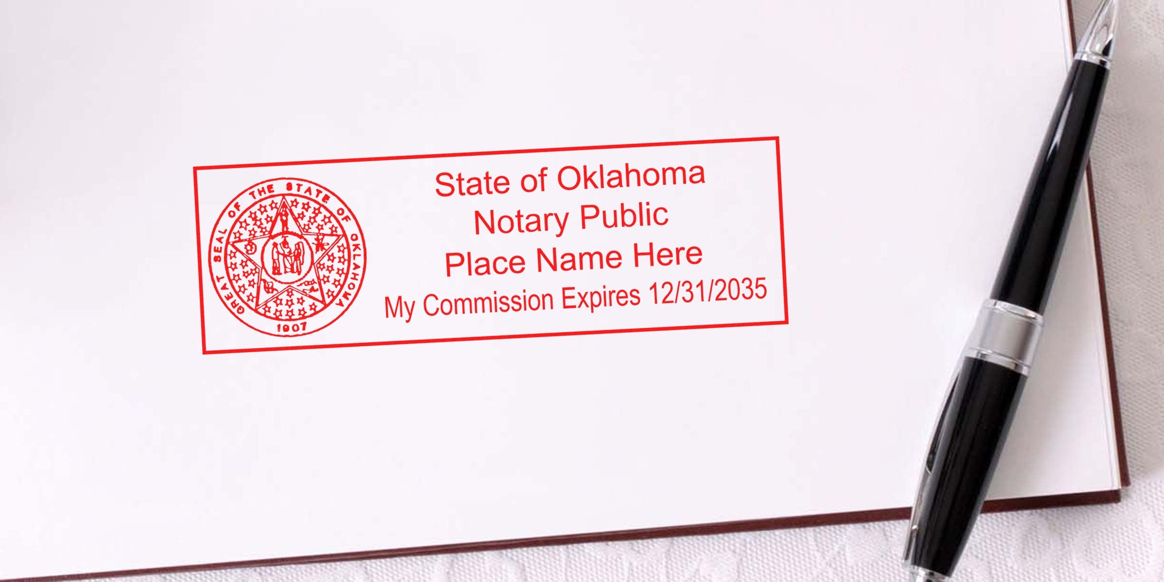 Red State of Oklahoma notary public stamp on white paper showing state seal, placeholder name and commission expires 12/31/2035, black pen beside the stamped box