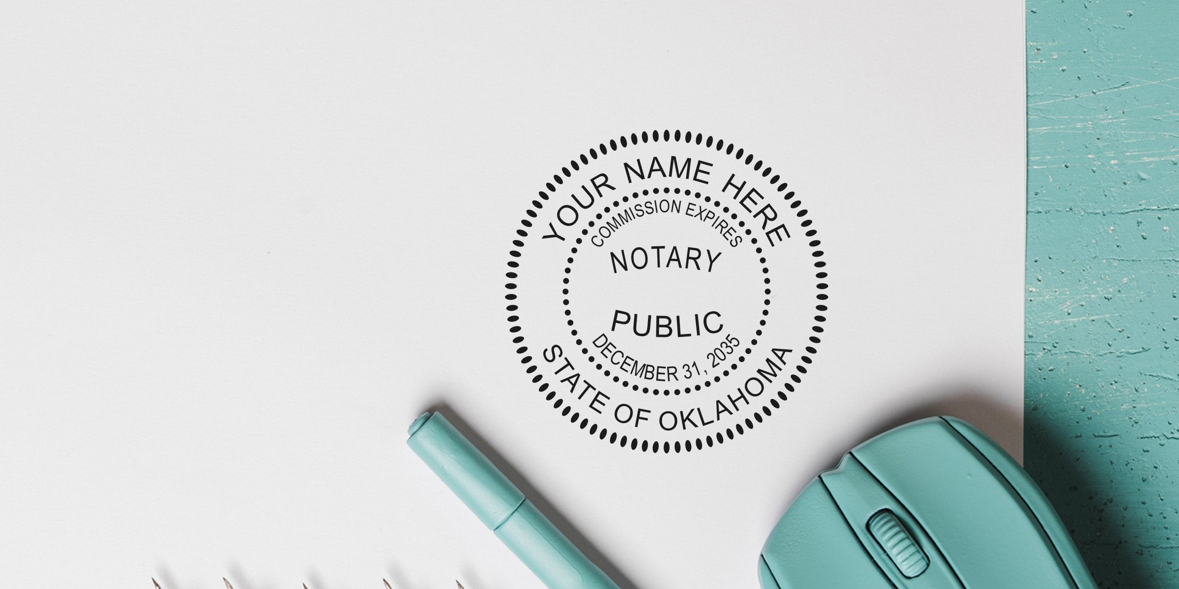 Notary public round seal stamped on white paper reading "State of Oklahoma" and "Commission expires December 31, 2035" beside a teal pen and wireless mouse on a textured teal desk — notary stamp, office stationery.