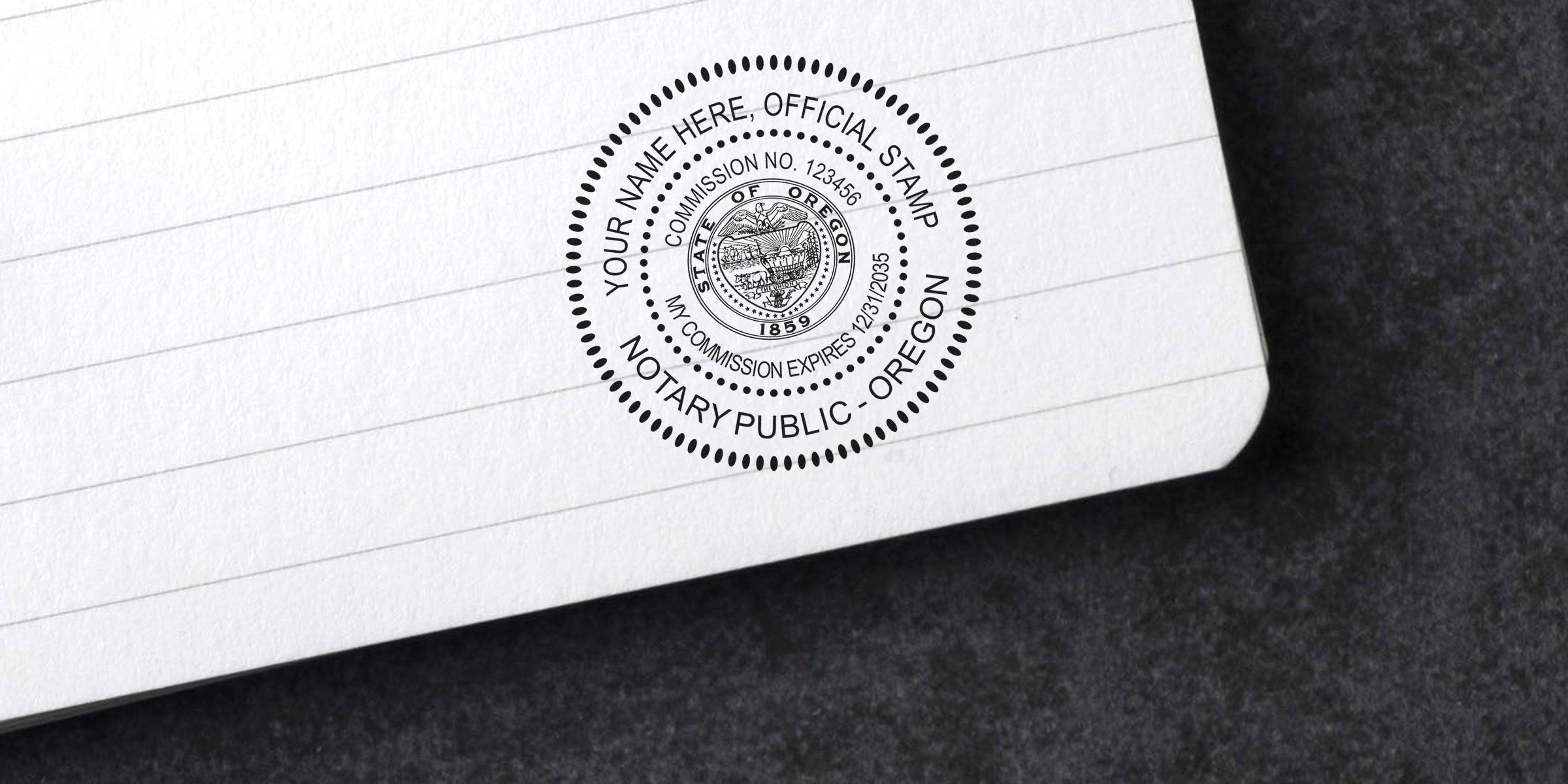 Round Oregon notary public stamp impression on lined notebook paper corner showing circular state seal, commission number and expiration date.