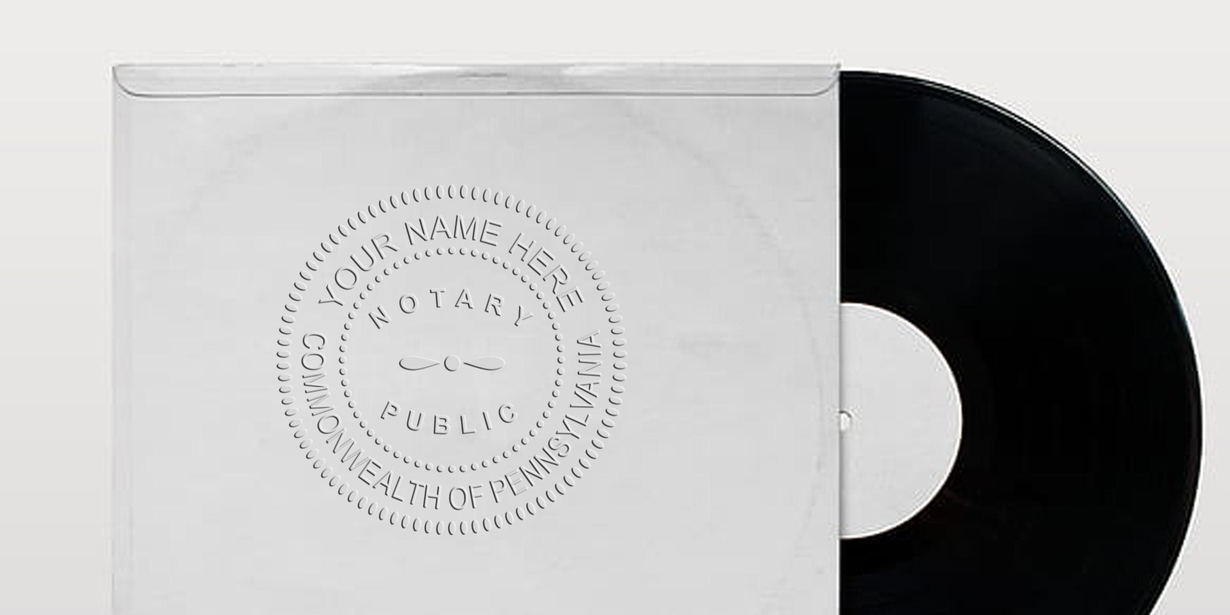 Black vinyl record partially inside a white paper sleeve embossed with a circular "Notary Public, Commonwealth of Pennsylvania" seal and placeholder text "Your Name Here"