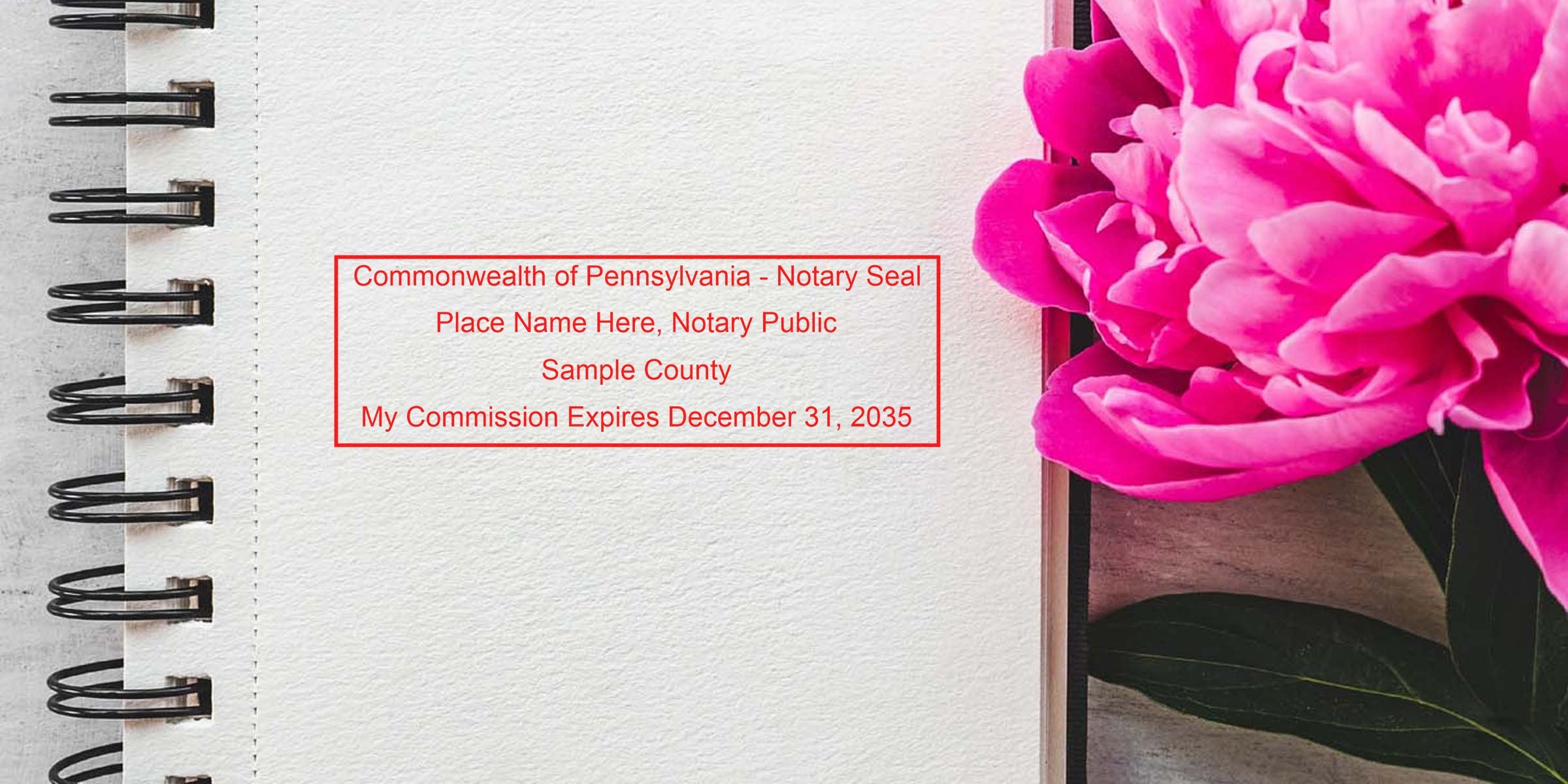 Spiral-bound notebook open to blank textured paper with a bright pink peony on right and red "Commonwealth of Pennsylvania - Notary Seal" sample text centered on page