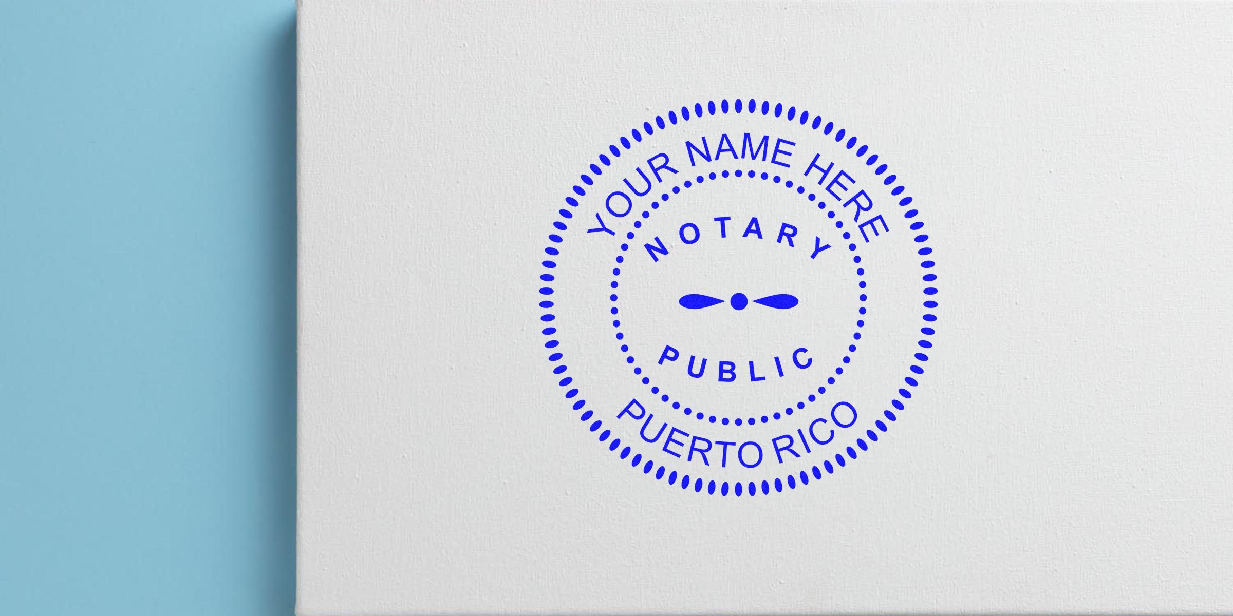 Blue circular notary public stamp reading "YOUR NAME HERE - NOTARY PUBLIC - PUERTO RICO" printed on white textured paper with a light blue edge background