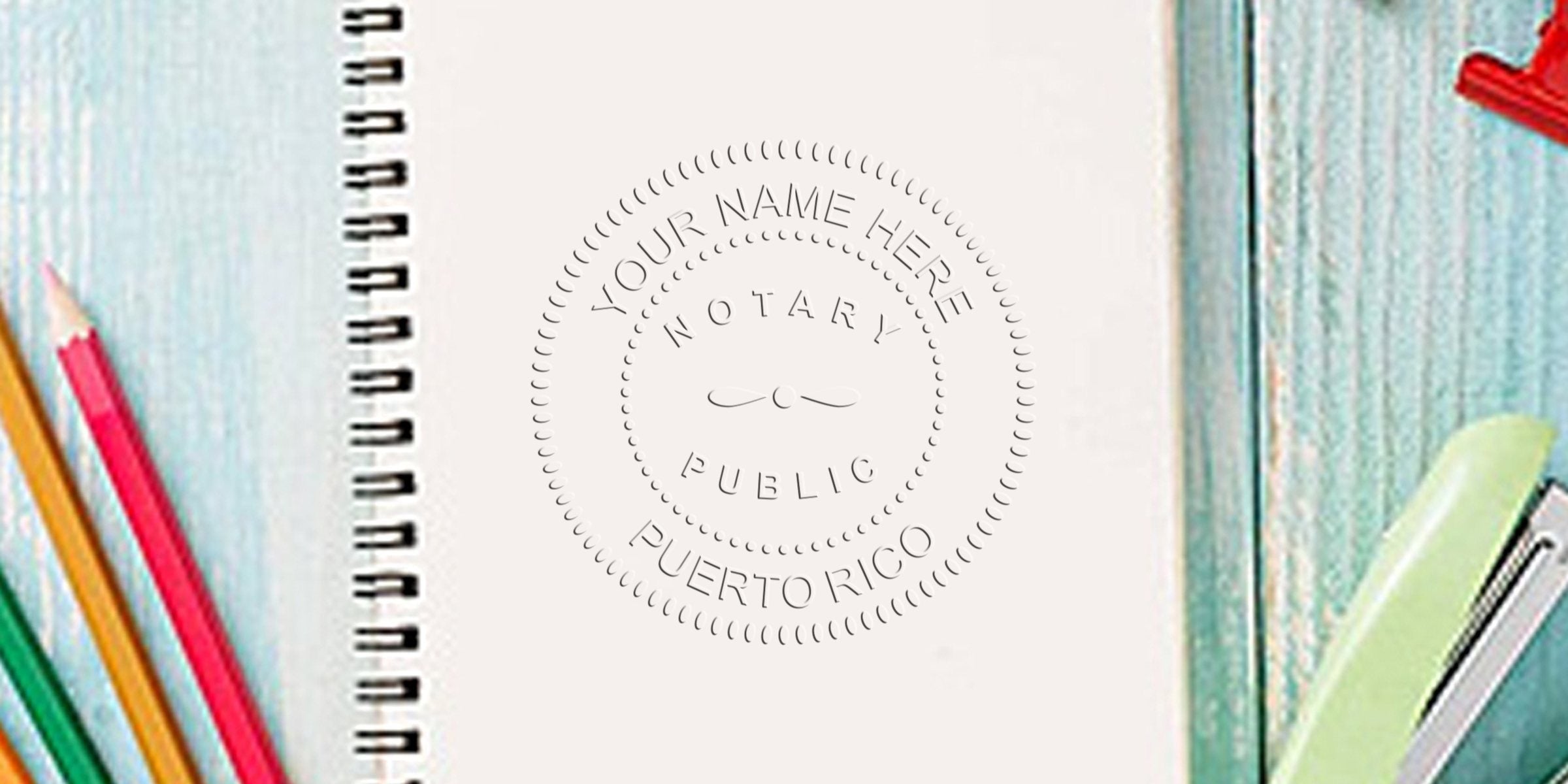 Spiral notebook with embossed "Notary Public Puerto Rico" seal on page, colorful pencils to the left and a green stapler on a teal wood desk — office desk notary paperwork concept.