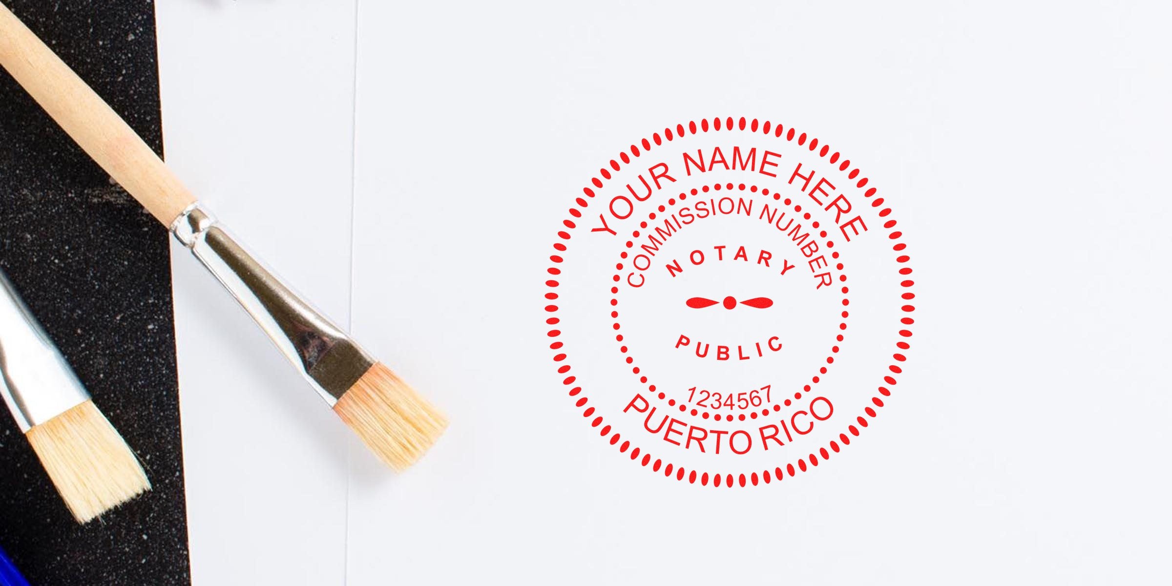 Top-down photo of paintbrushes beside a red circular notary public stamp mockup reading "Your Name Here", commission number and "Puerto Rico" on white paper