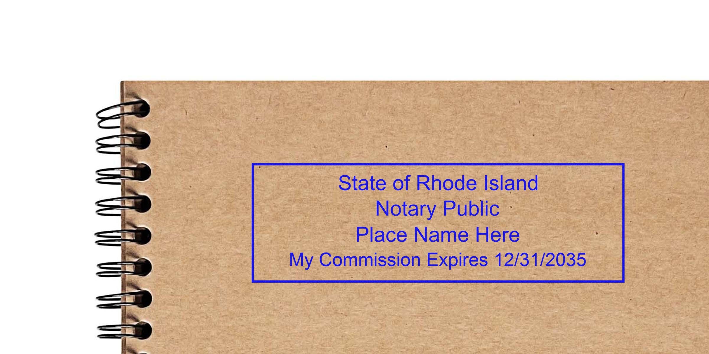 Spiral-bound kraft notebook with a blue rectangular "State of Rhode Island Notary Public" stamp placeholder reading "Place Name Here" and "My Commission Expires 12/31/2035" on the cover.
