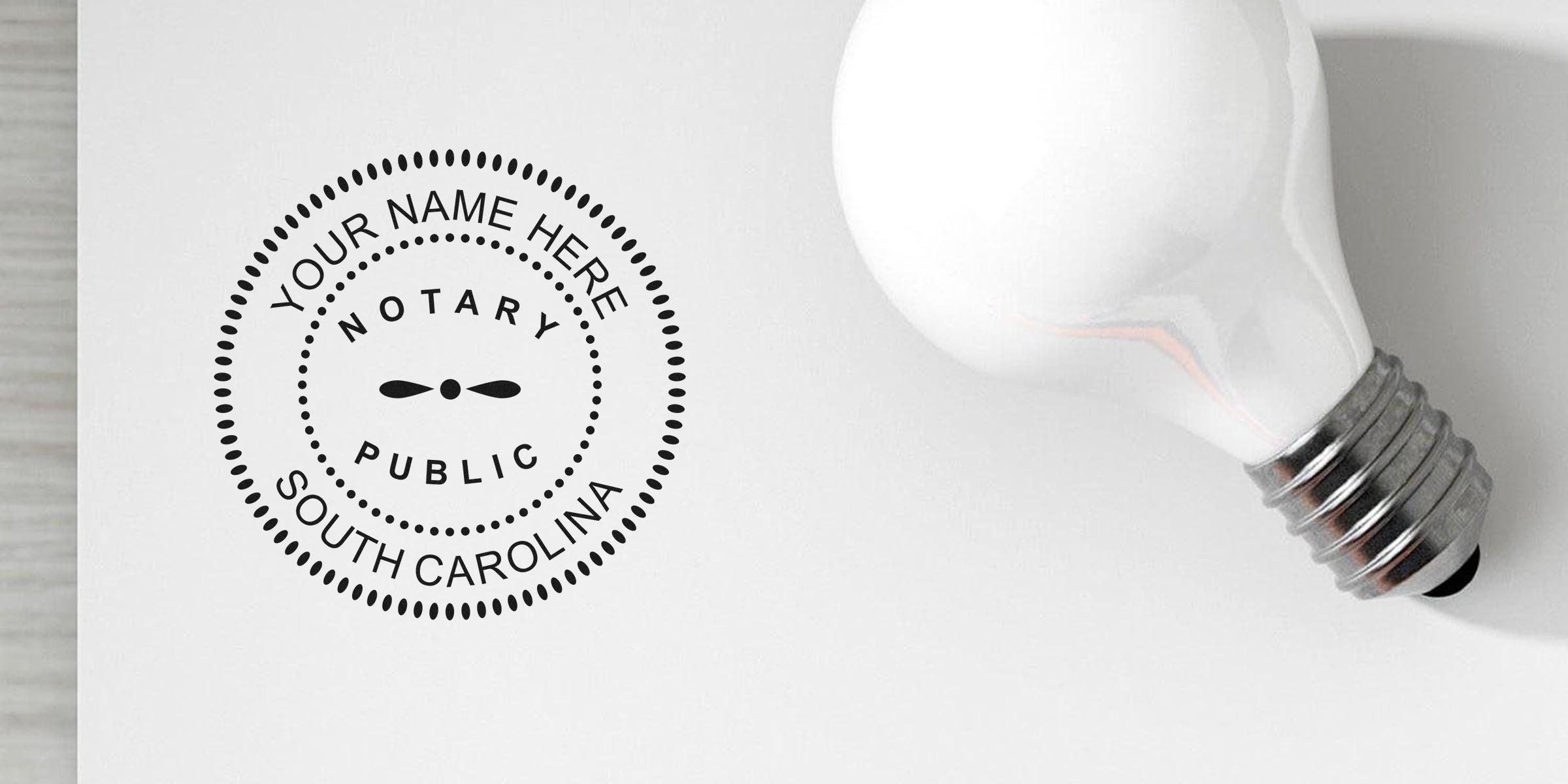 Flatlay of white light bulb beside circular Notary Public stamp mockup reading "Your Name Here, South Carolina" on white background — business branding, legal seal, office stationery.