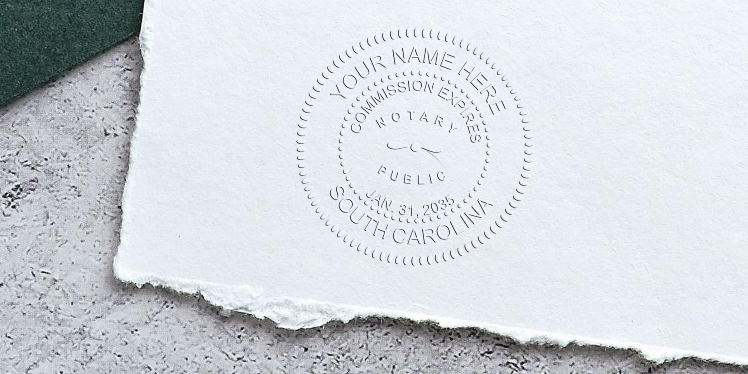 Embossed notary public seal reading "South Carolina" with circular "Commission Expires" and date imprint on torn textured white paper over a concrete background — close-up legal document seal.