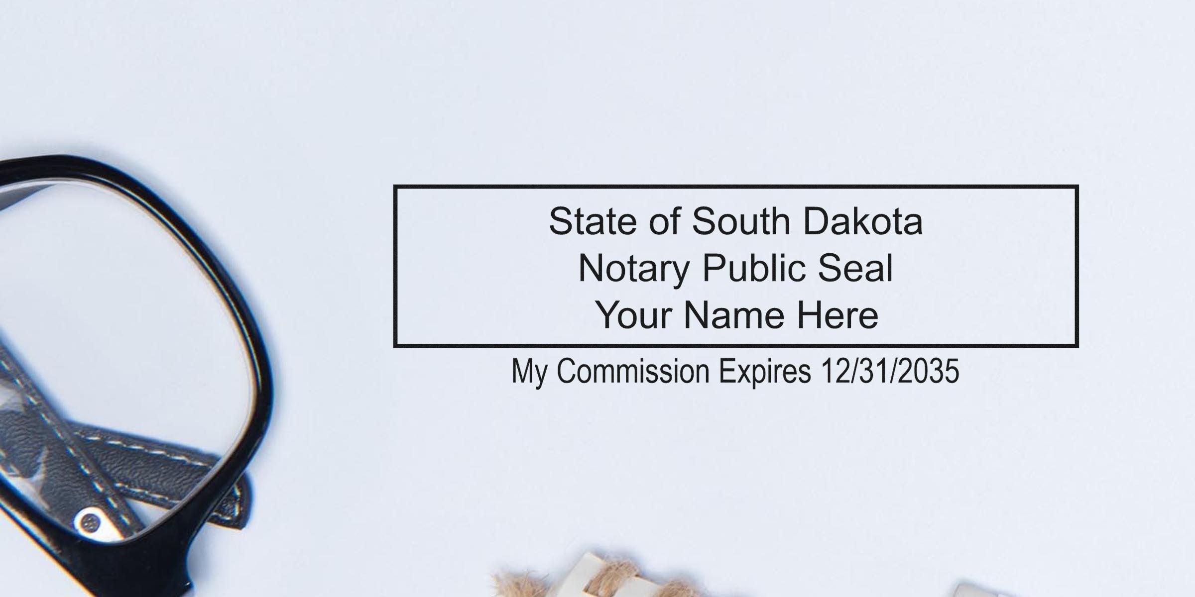 State of South Dakota notary public rectangular seal mockup reading "Your Name Here" with commission expires 12/31/2035 on white background, partial eyeglasses visible.
