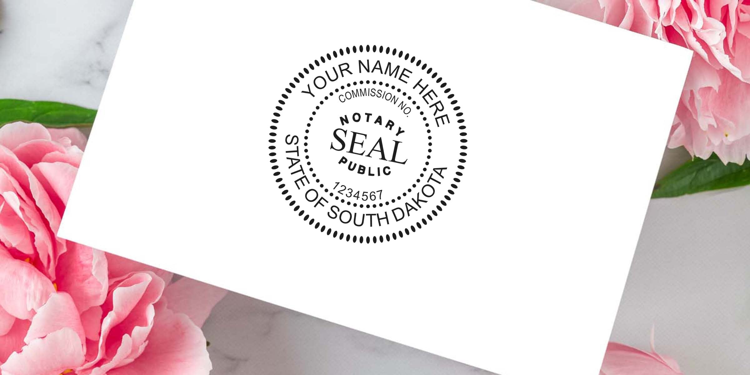 Mock notary public seal stamp on white card reading "Notary Seal Public, State of South Dakota" with placeholder name and commission number, styled on a marble surface with pink peony flowers background.