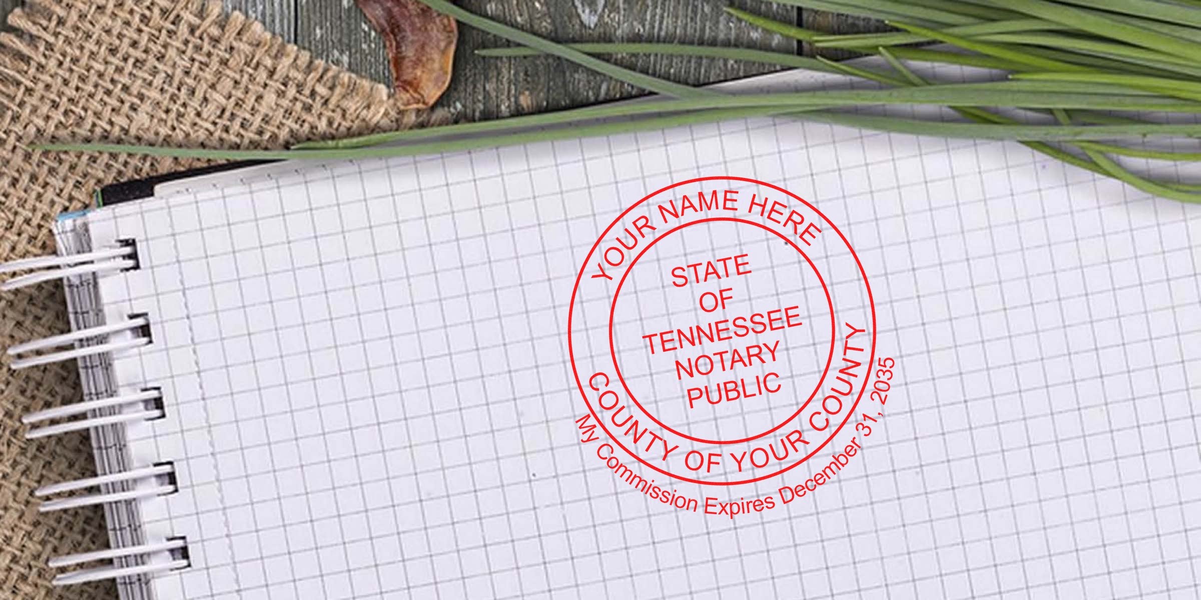 Red circular Tennessee notary seal stamp mockup on grid notebook paper with spiral binding, burlap texture and green grass accents for notary business listing
