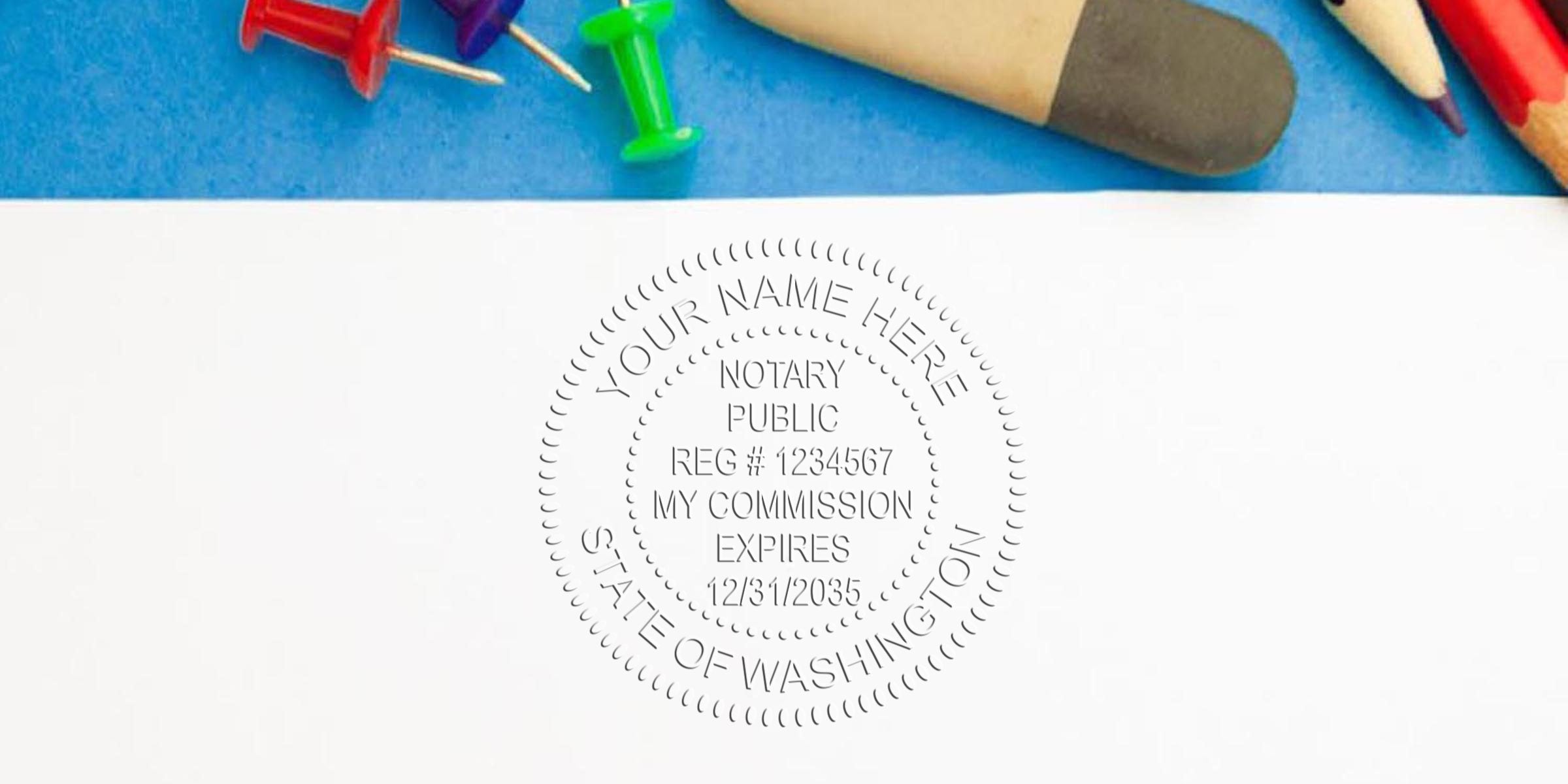 Embossed notary public seal impression on white paper with colorful push pins, eraser and colored pencils on blue background