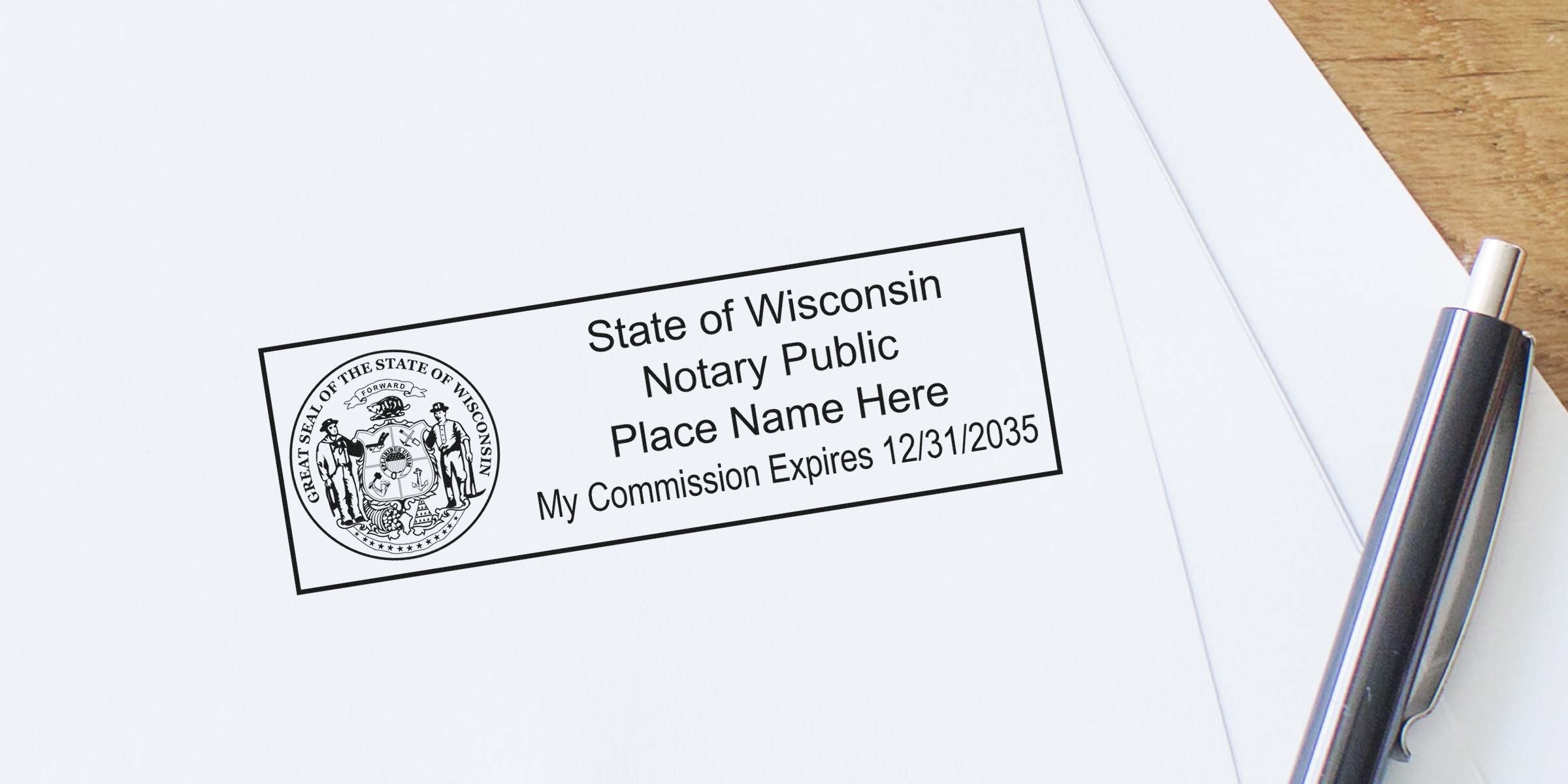 Close-up of Wisconsin notary public stamp on white paper showing state seal, placeholder name, and commission expiration date 12/31/2035 with pen nearby