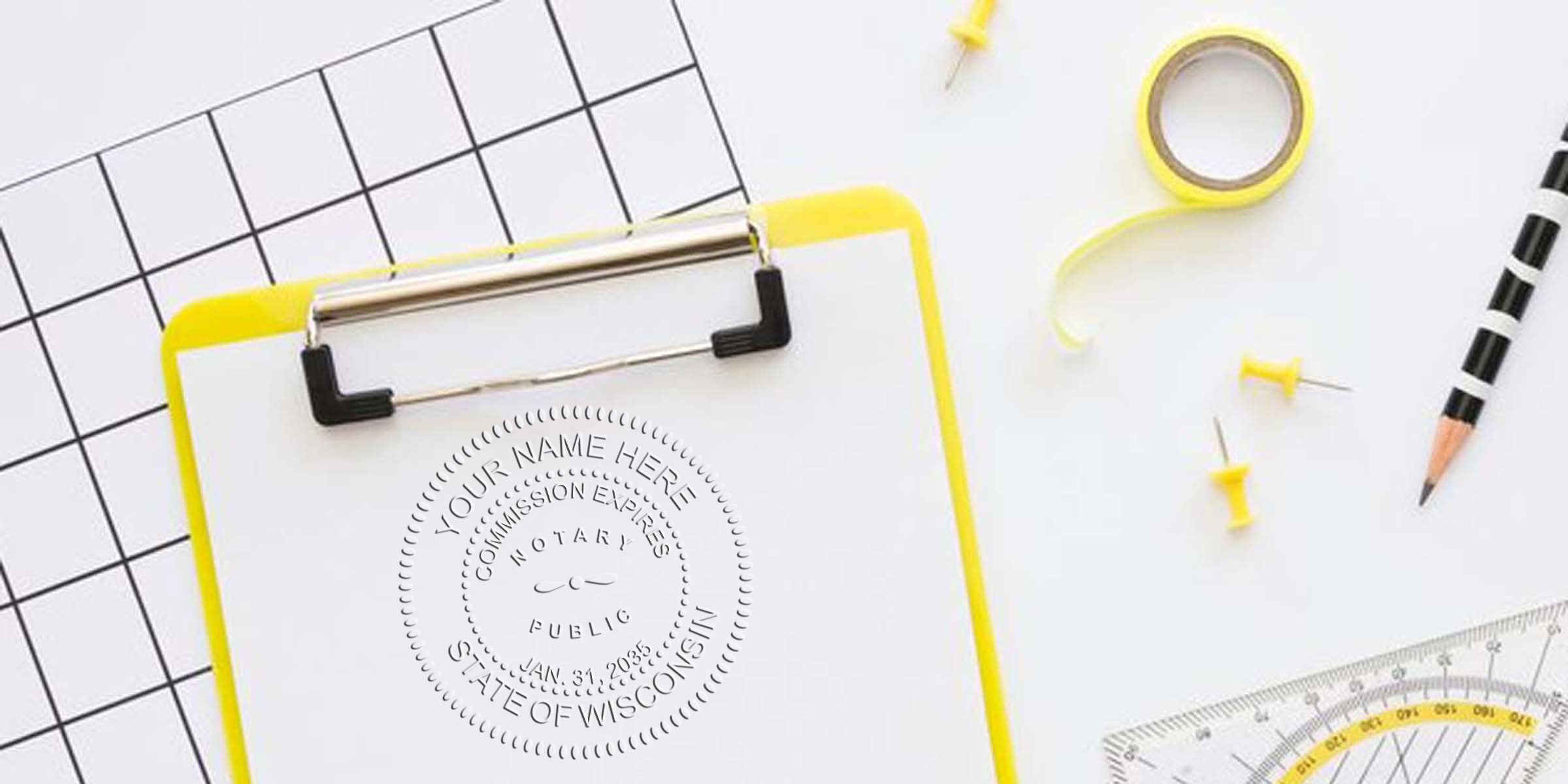 Top-down view of a yellow-edged clipboard with blank paper showing an embossed notary seal, surrounded by yellow tape, push pins, striped pencil, grid paper and a protractor on a white desk.