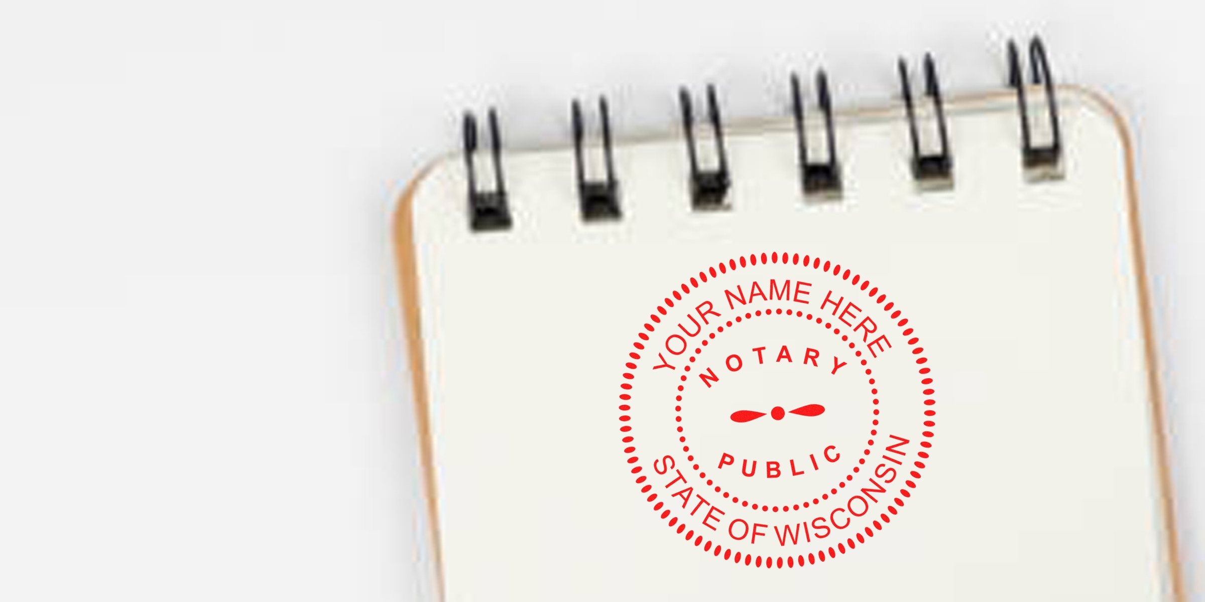 Spiral-bound notebook page with a red circular Notary Public seal reading "Your Name Here" and "State of Wisconsin" centered on the paper.