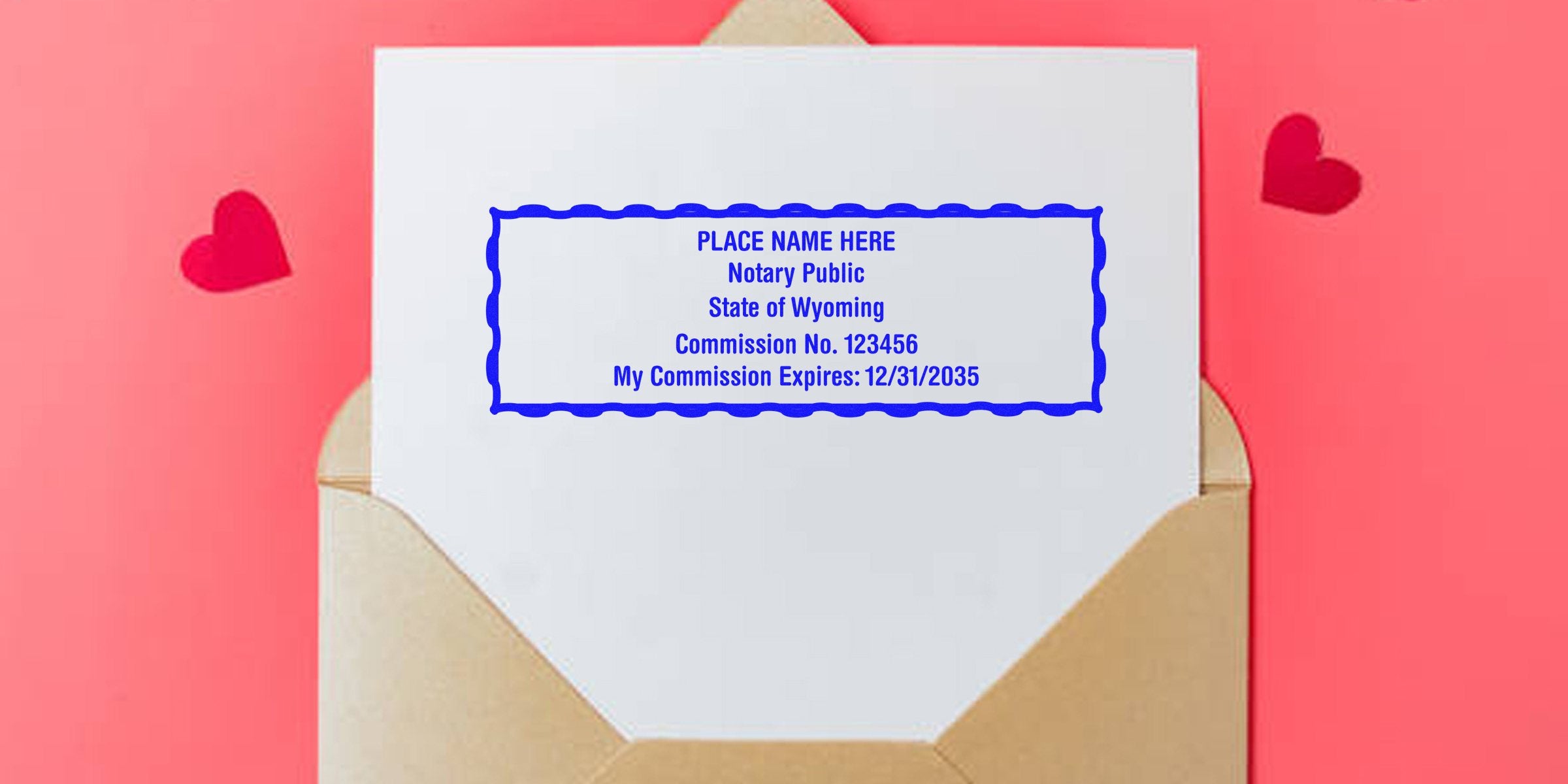 Brown envelope with white card stamped in blue reading "Notary Public State of Wyoming" sample commission info inside a decorative blue border on a pink background with two red paper hearts.