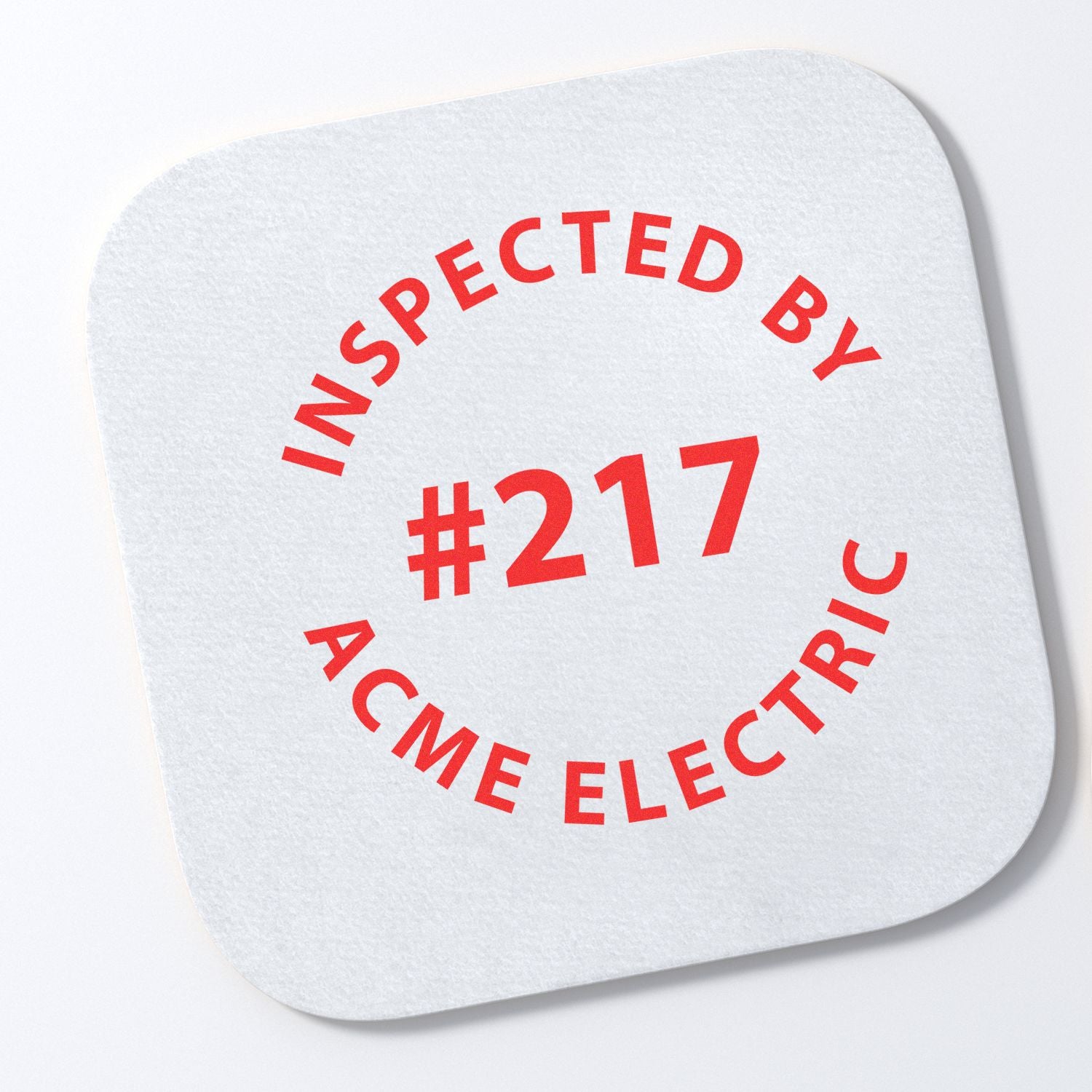 Elevate Your Brand: Logo Stamps for Business Success feature image showing a custom stamp with 'Inspected by #217 ACME Electric' in red ink.