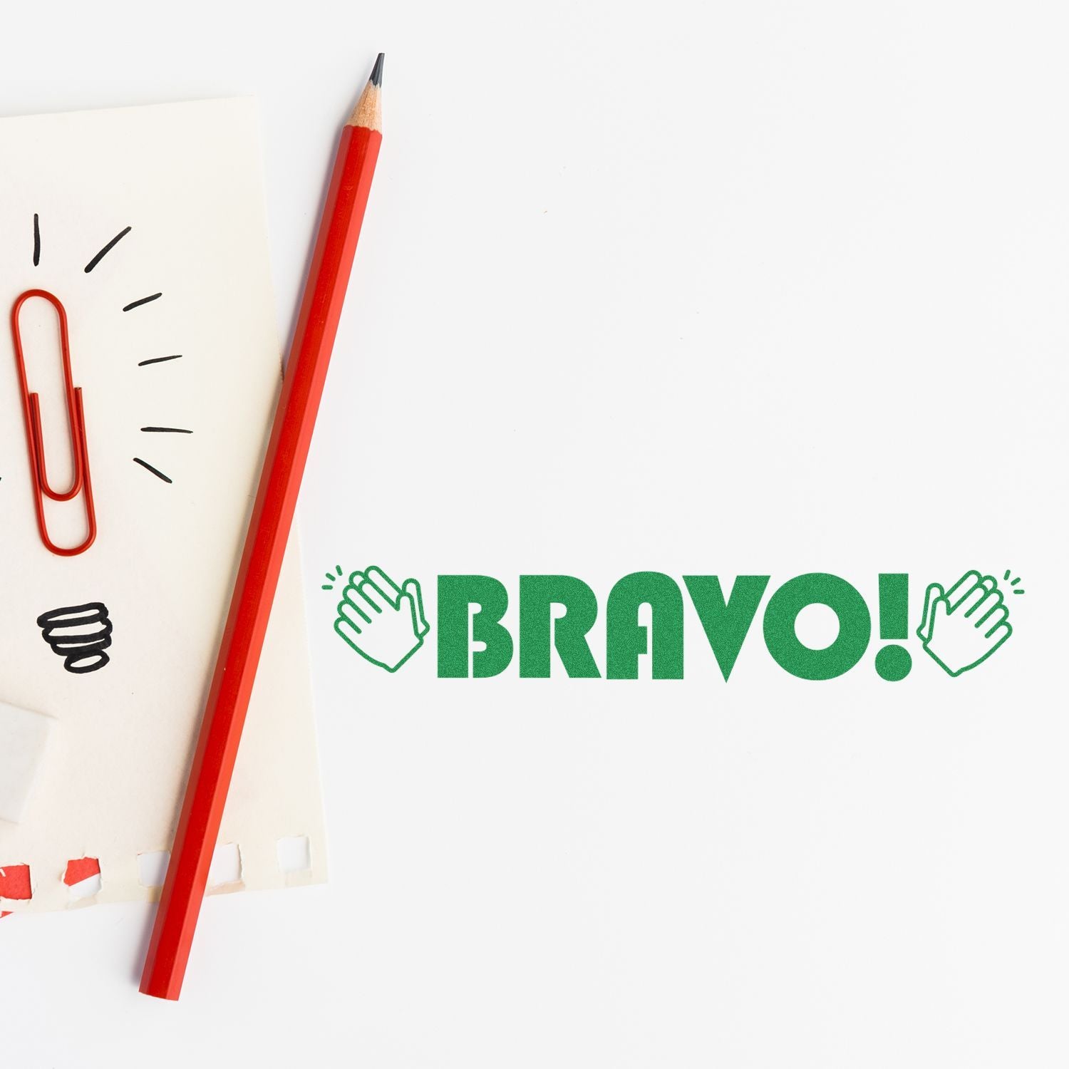 Teacher Grading Stamps Blog Post Feature Image: A red pencil, paperclip, and a 'BRAVO!' stamp with clapping hands on a white background.