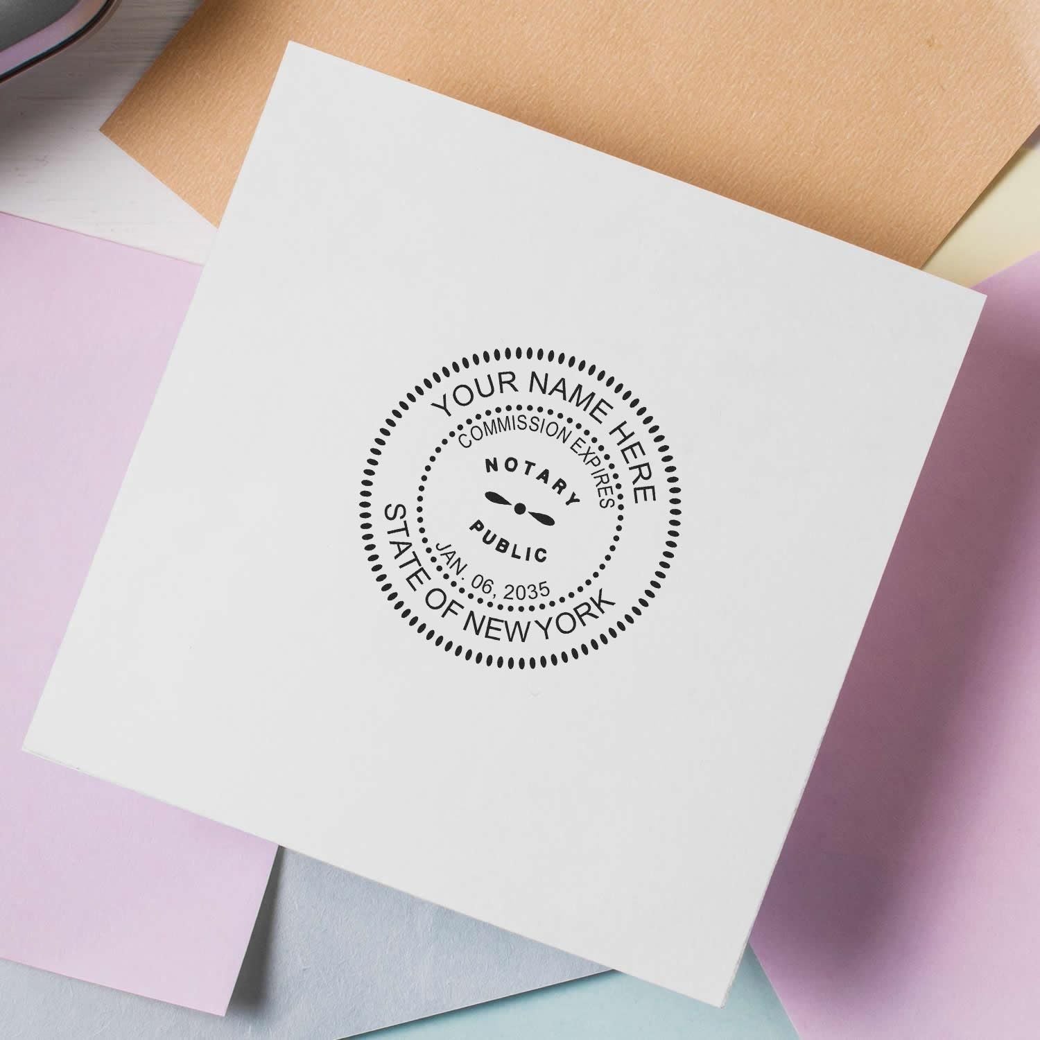 New York Notary Supplies Blog Post Feature Image: Close-up of a New York notary public round stamp on a white paper with pastel backgrounds.