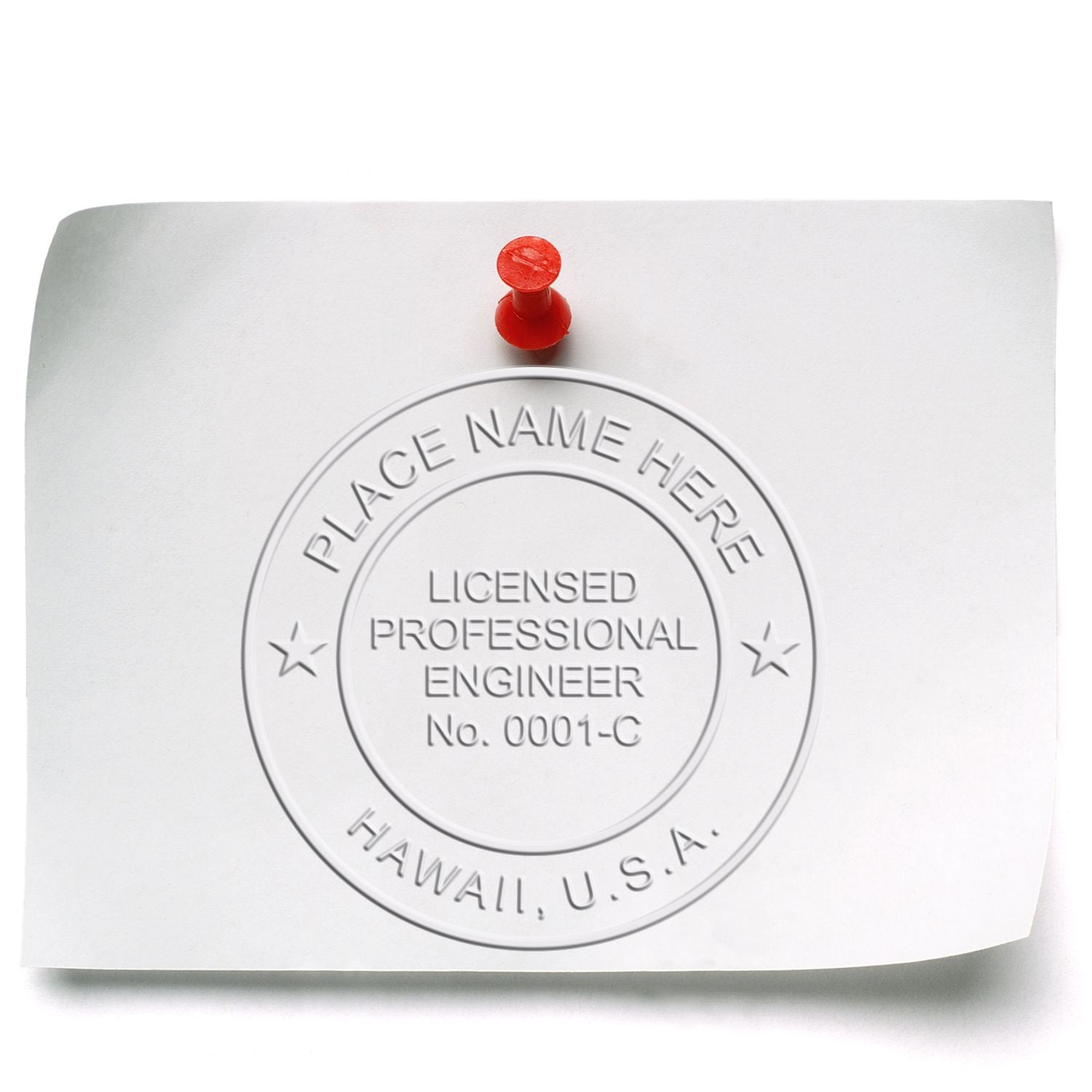 Image of a Hawaii Professional Engineer Embosser Seal on a white paper pinned with a red pushpin. Blog post: Hawaii Professional Engineer Embosser Seal.