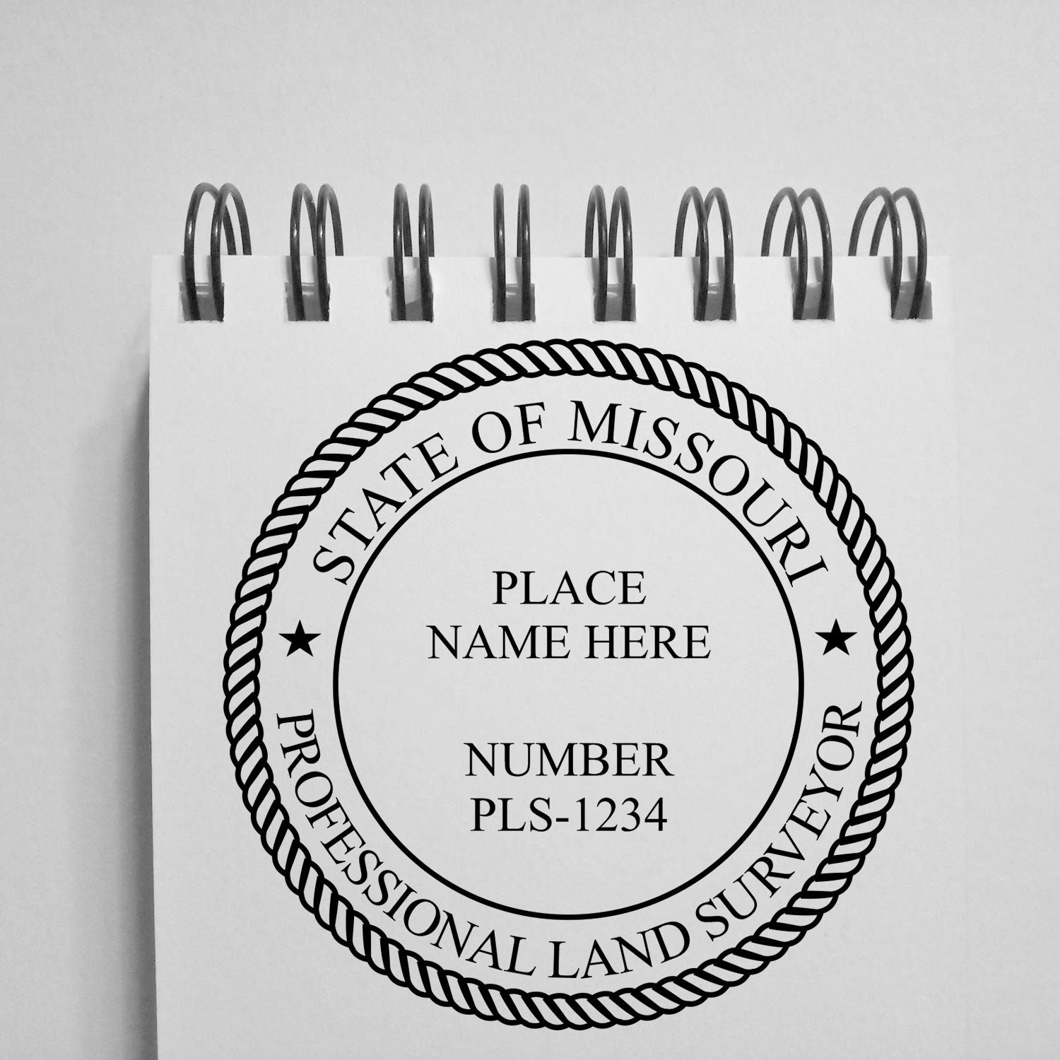 Image of a Missouri Land Surveyor Seal on a notepad. Blog post: Missouri Land Surveyor Seal: Your Secret Weapon for Success.