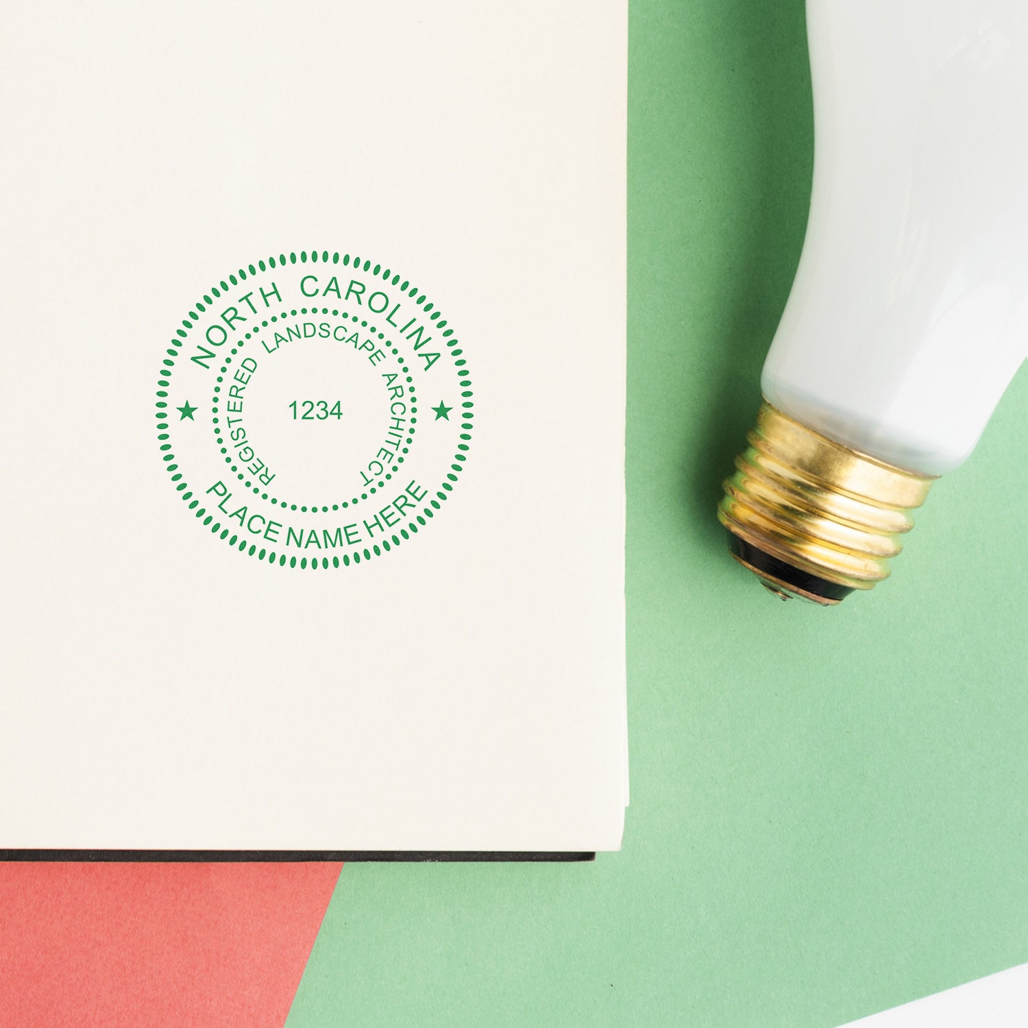 North Carolina Landscape Architect Feature Image: A green seal stamp on a white paper next to a light bulb on a colorful background.